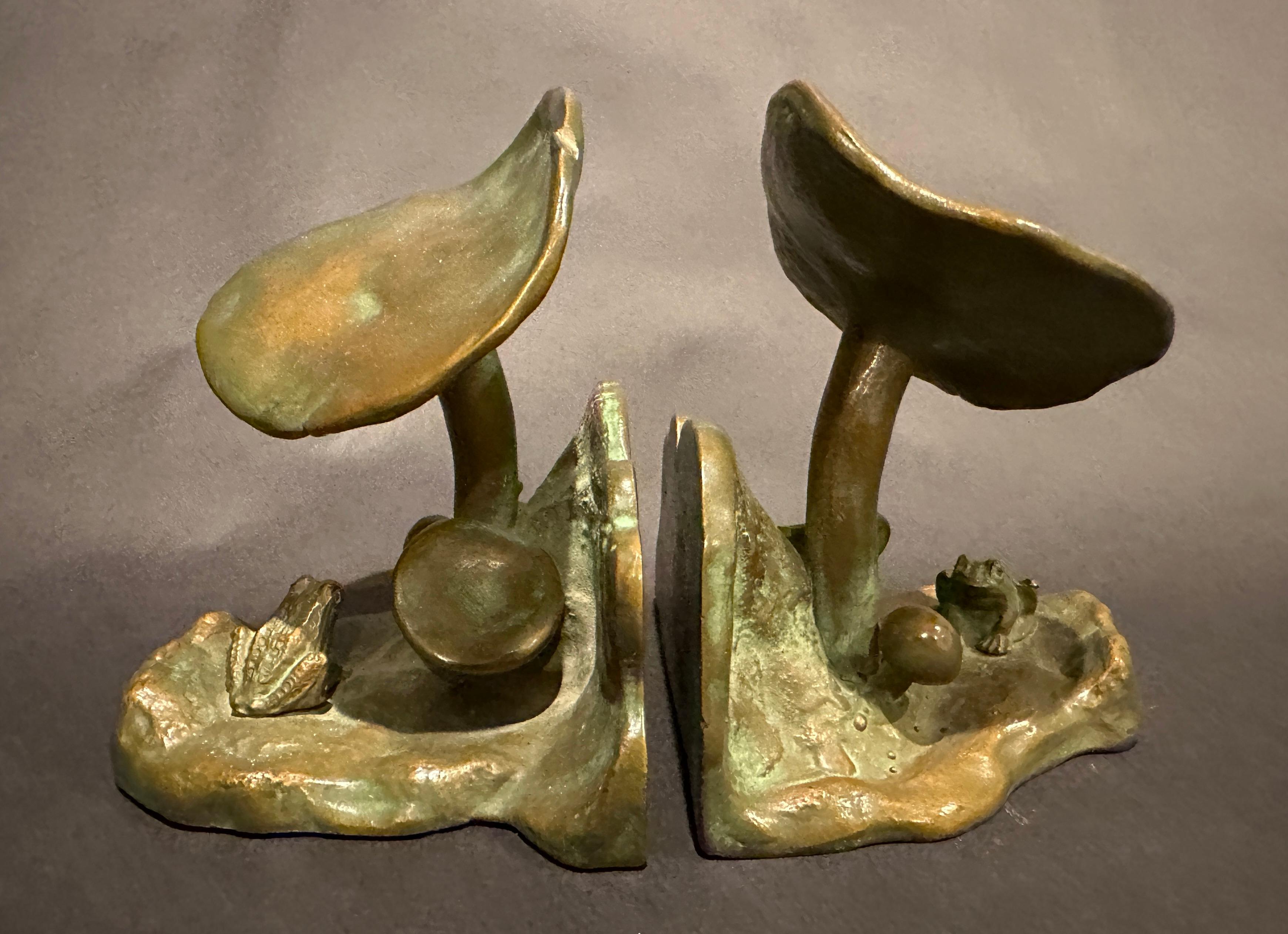 Pair of bronze mushroom and frog motif bookends by McClelland Barclay McClelland Barclay (1891-1943), American sculptor In two parts, each one beautifully cast of a landscape with mushrooms and a seated frog, inscribed signature on back Each bookend