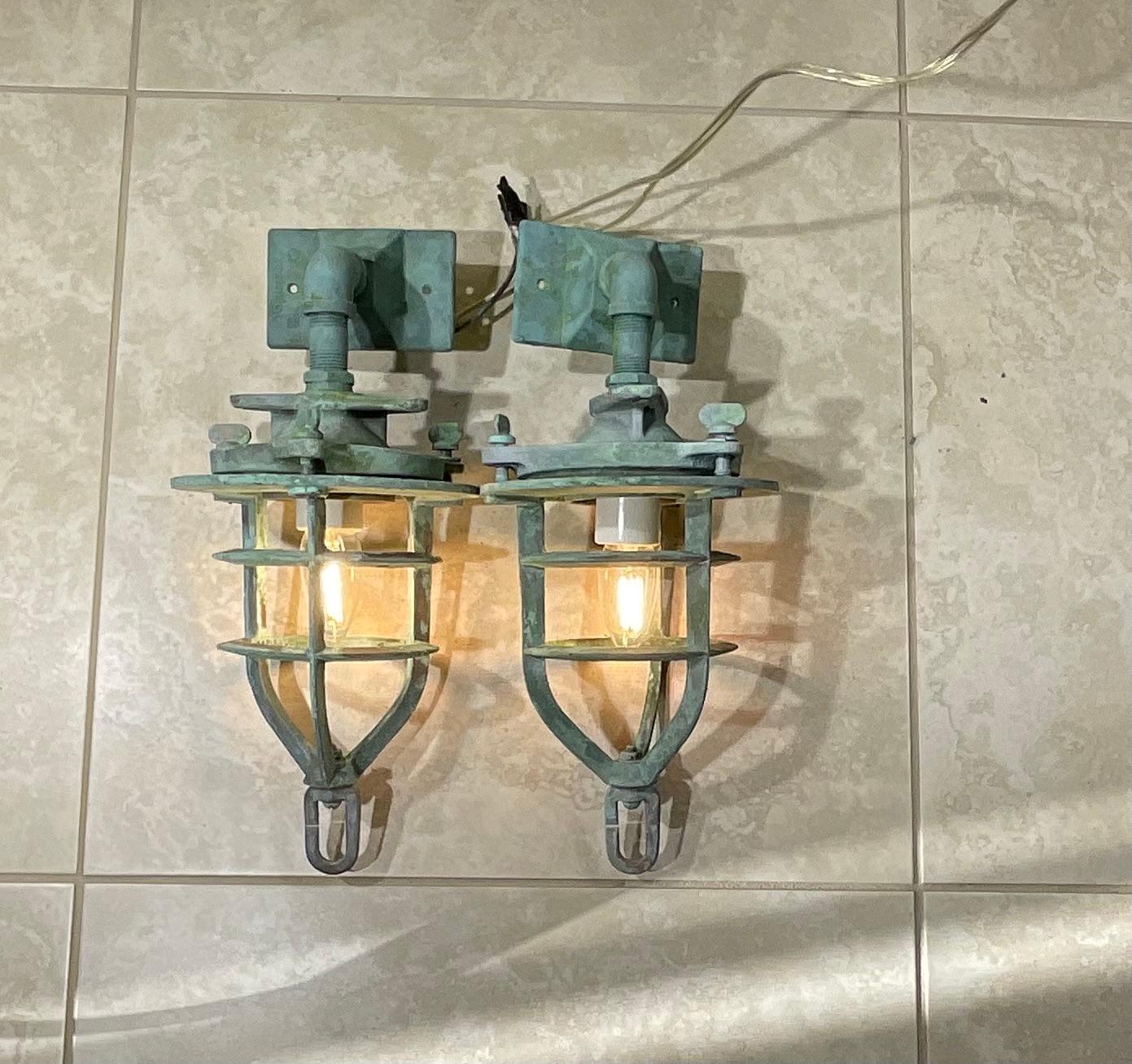 
Original marine convoy lights from a ship , original solid bronze cage. porcelain socket  for one 60/watt light. Beautiful patina .
Steel Backplate size 5” x3”
Glass compartment is not included