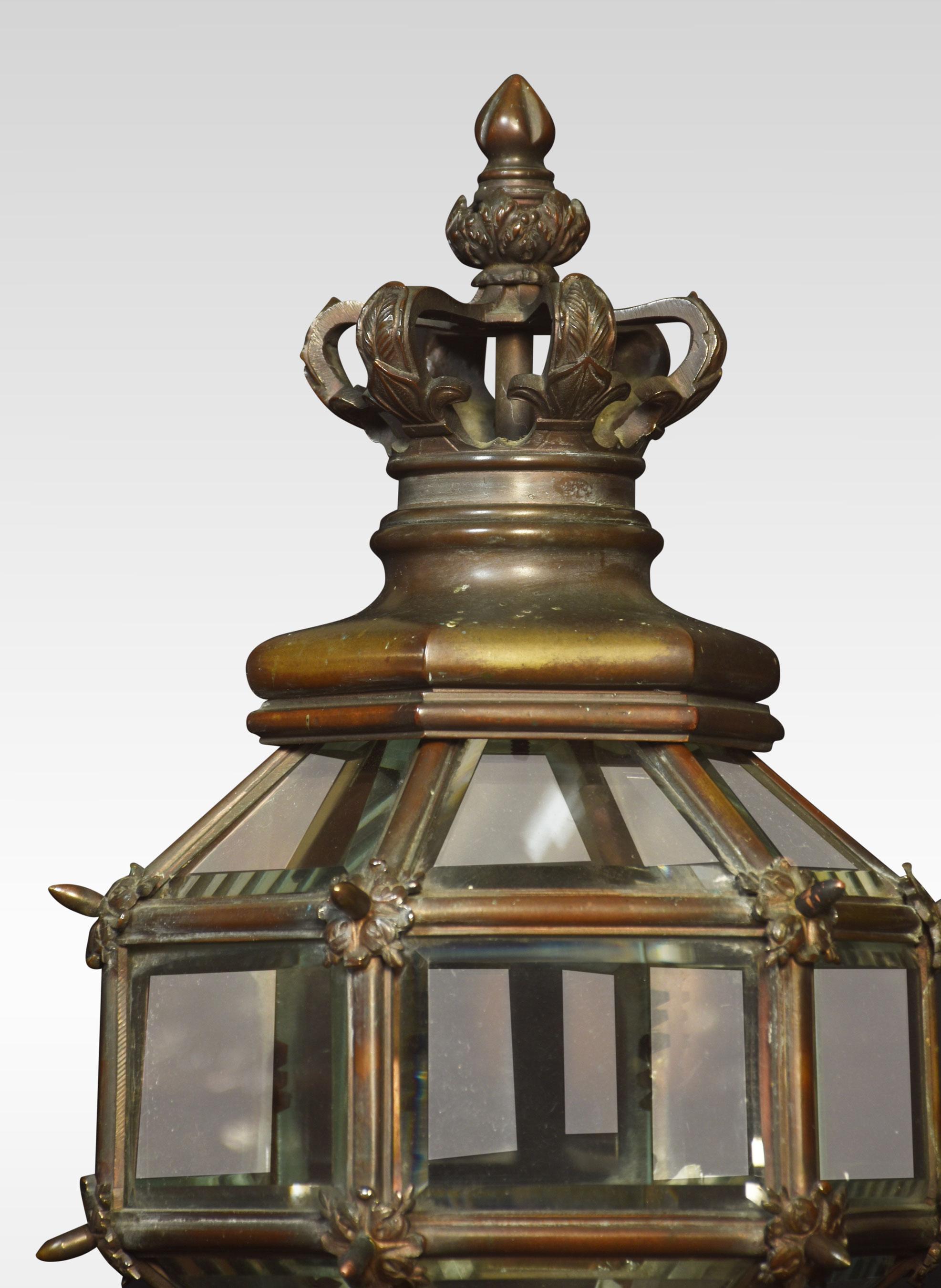 Pair of bronze newel post lamps, the crown tops above hexagonal glazed lantern raised up on reeded stem and circular bases. The lamps have been rewired.
Dimensions
height 37 inches
width 9.5 inches
depth 9.5 inches.
 