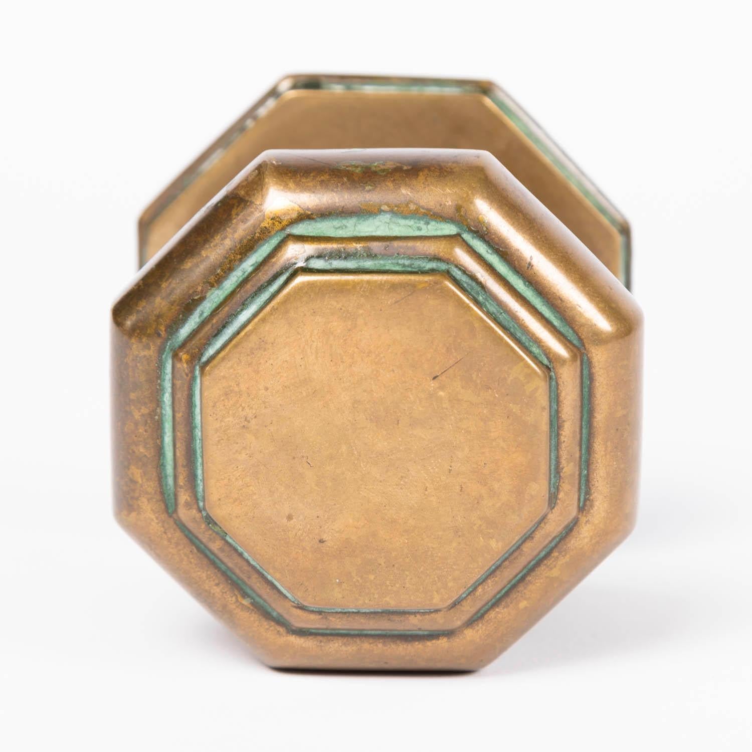 A pair of late 19th century bronze octagonal door centre pulls.

With fixing bolts.

Projection from door: 3 1/2 inches - 9 cm.