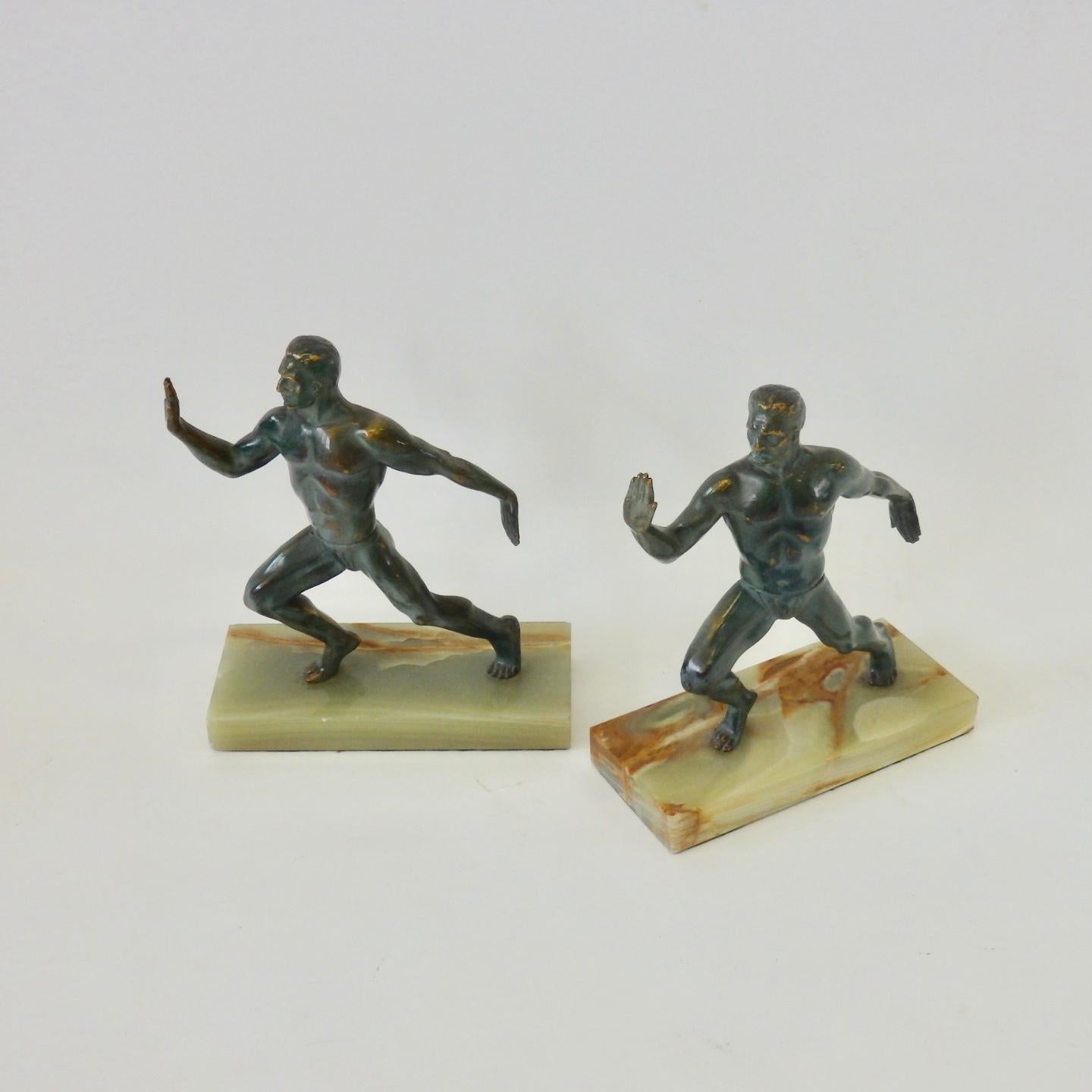 What is better than a pair of two strong Greek athletes in sculpted in bronze on marble bases supporting your books ?