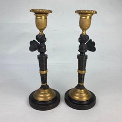 Pair of Bronze & Ormolu Putti Candlesticks