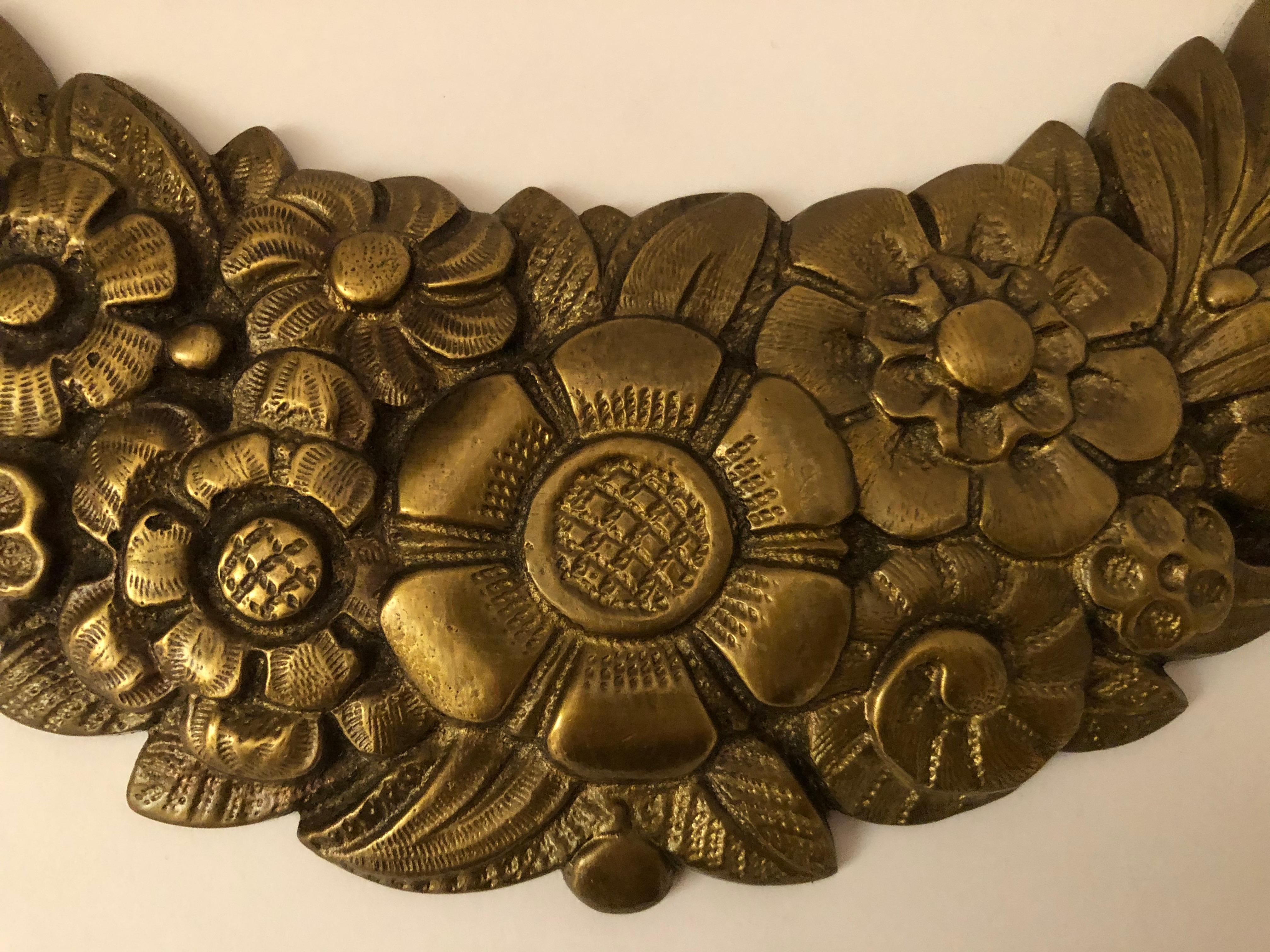 Pair of bronze ornamental garlands. Sculpted bronze garlands are the perfect accent on any door, mirror or wall. 

Property from esteemed interior designer Juan Montoya. Juan Montoya is one of the most acclaimed and prolific interior designers in