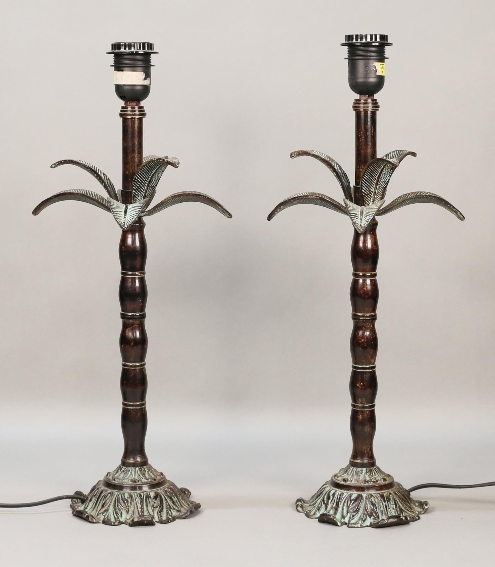 Pair of Bronze Palm Tree Stylized Accent Lamps with aged Verdigris details

Anonymous, in the manner of Maitland-Smith
20th century; Europe
Bronze

Approximate size: 19.75 (h) x 8 (w) x 8 (d) in. (without shades)

A handsome pair of bronze Palm Tree