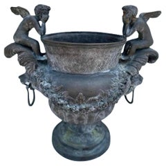 Pair of Bronze Planters with Cherubs and Lion Faces with Rings