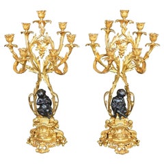 Pair of Bronze Putti Candelabras