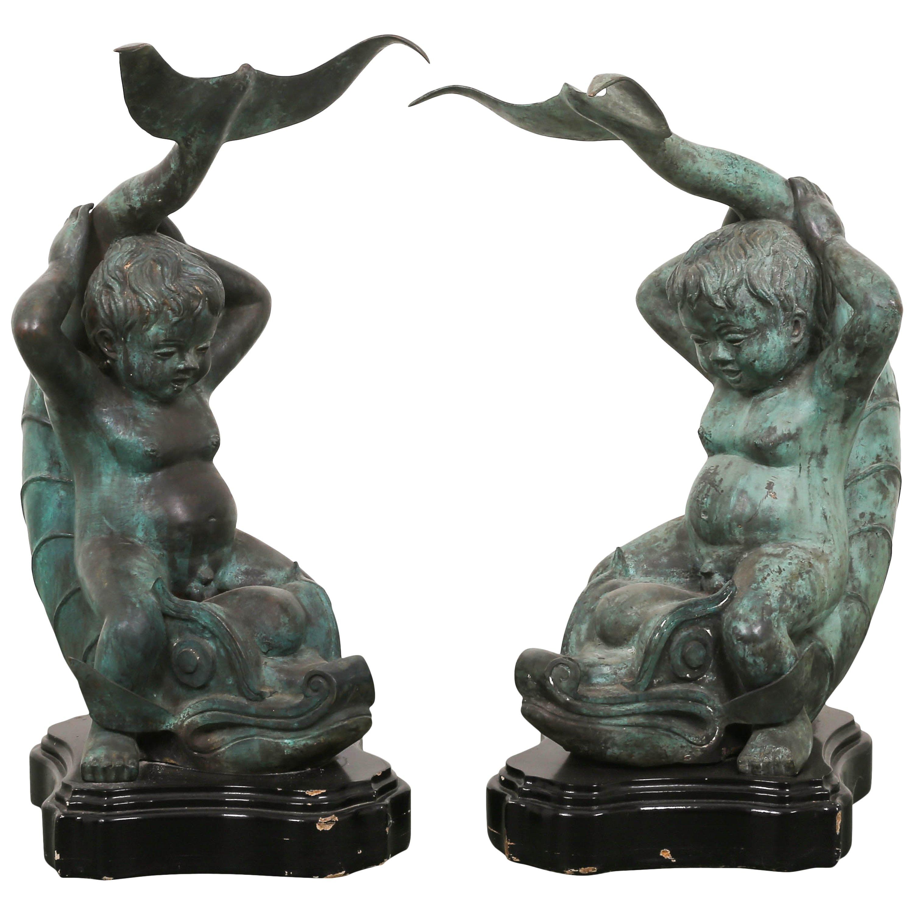 Pair of Bronze Putti on Dolphin Garden Statues For Sale