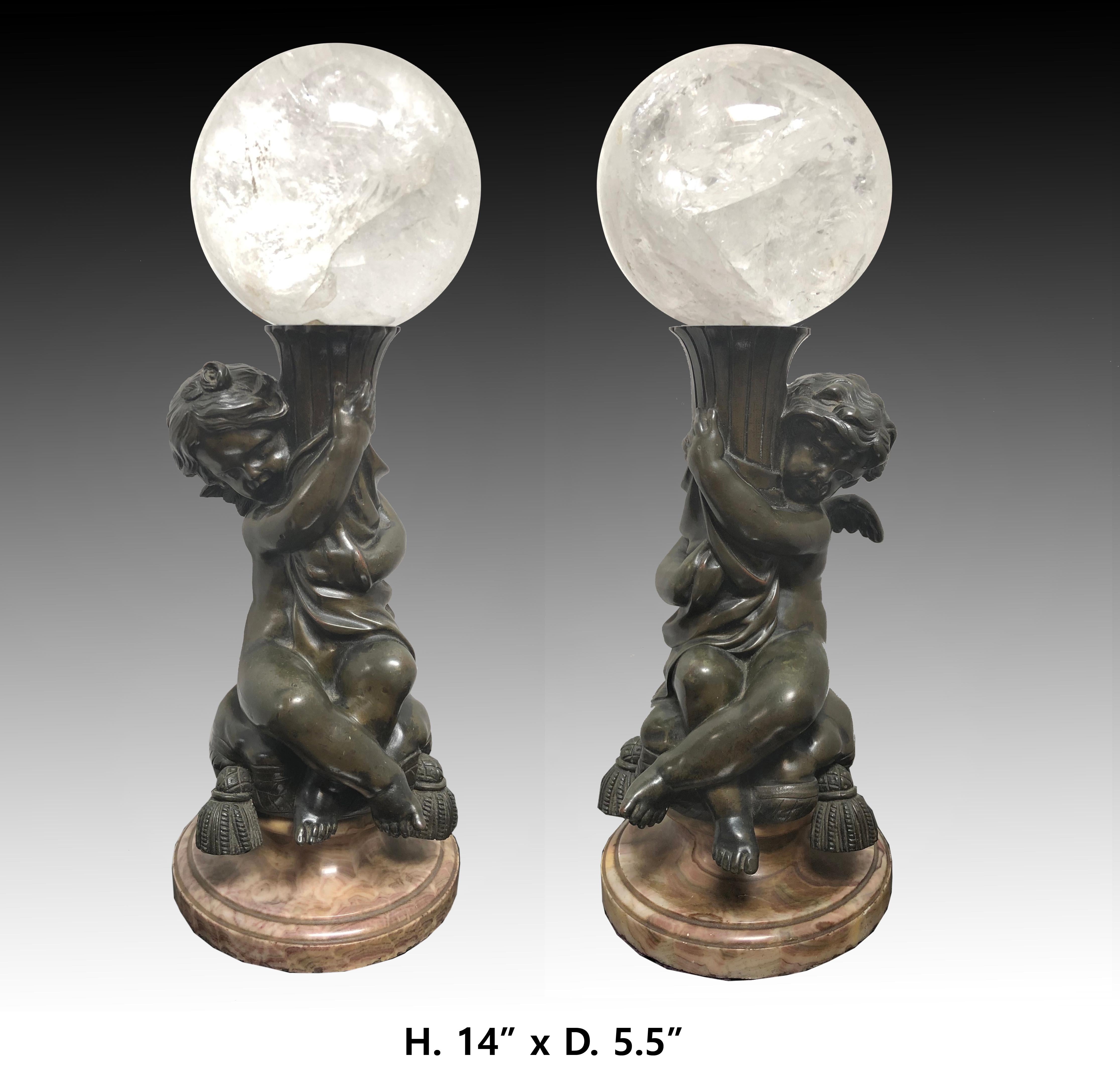 Impressive 19 century pair of bronze babies with rock crystal spheres..
Can be placed everywhere and make a big statement. 