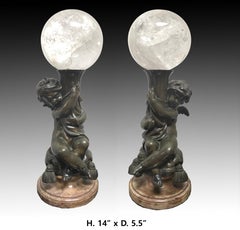 Pair of Bronze Putti  With Rock Crystal Spheres