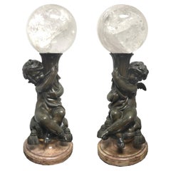 Pair of Bronze Putti  With Rock Crystal Spheres