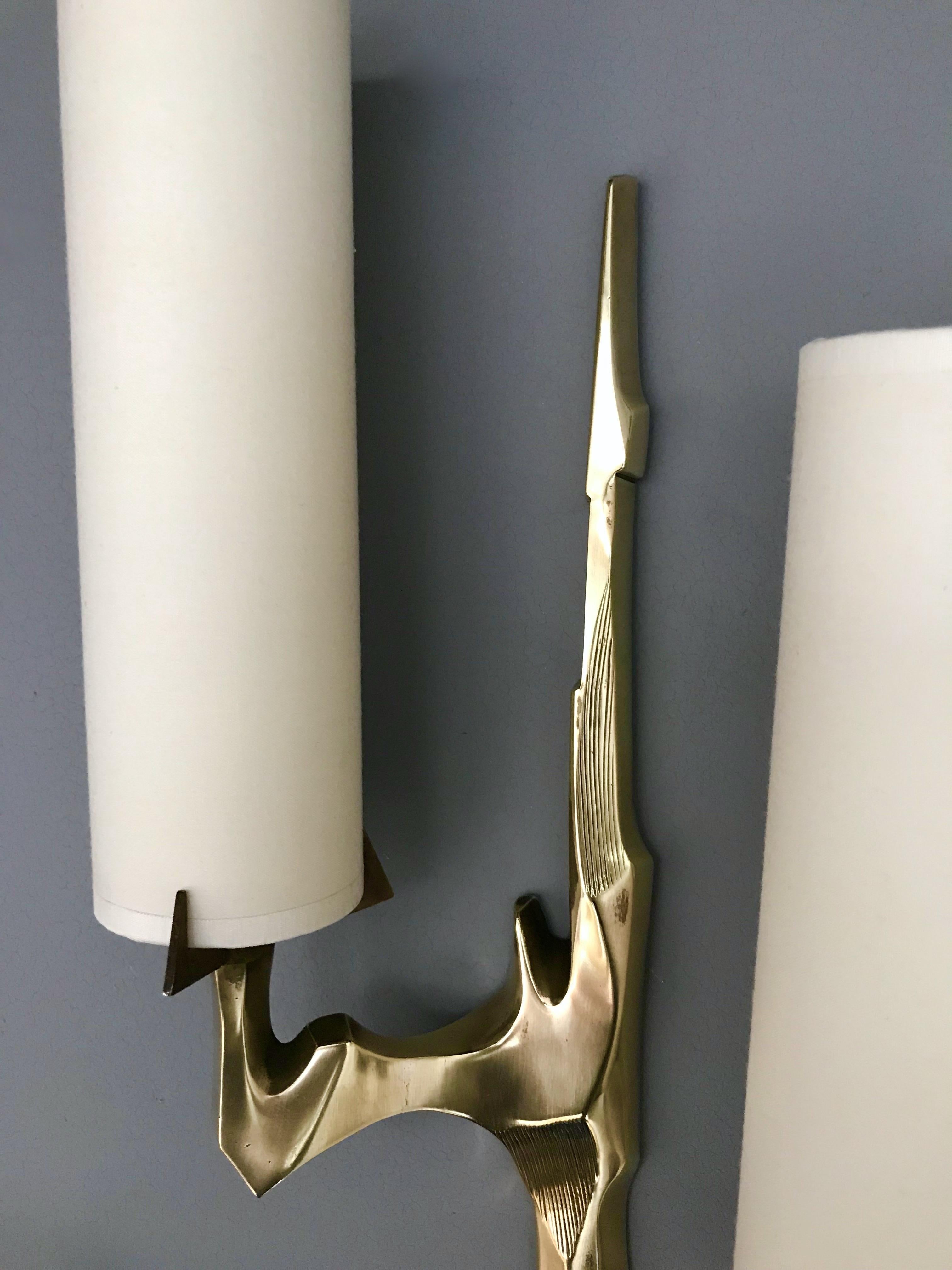 Pair of sconces or wall lights by Maison Arlus based on Felix Agostini drawing for the manufacture. In cast gilt bronze, very interesting and sculptural model. On request original Arlus advertising from the 1960s. It’s a famous manufacture like