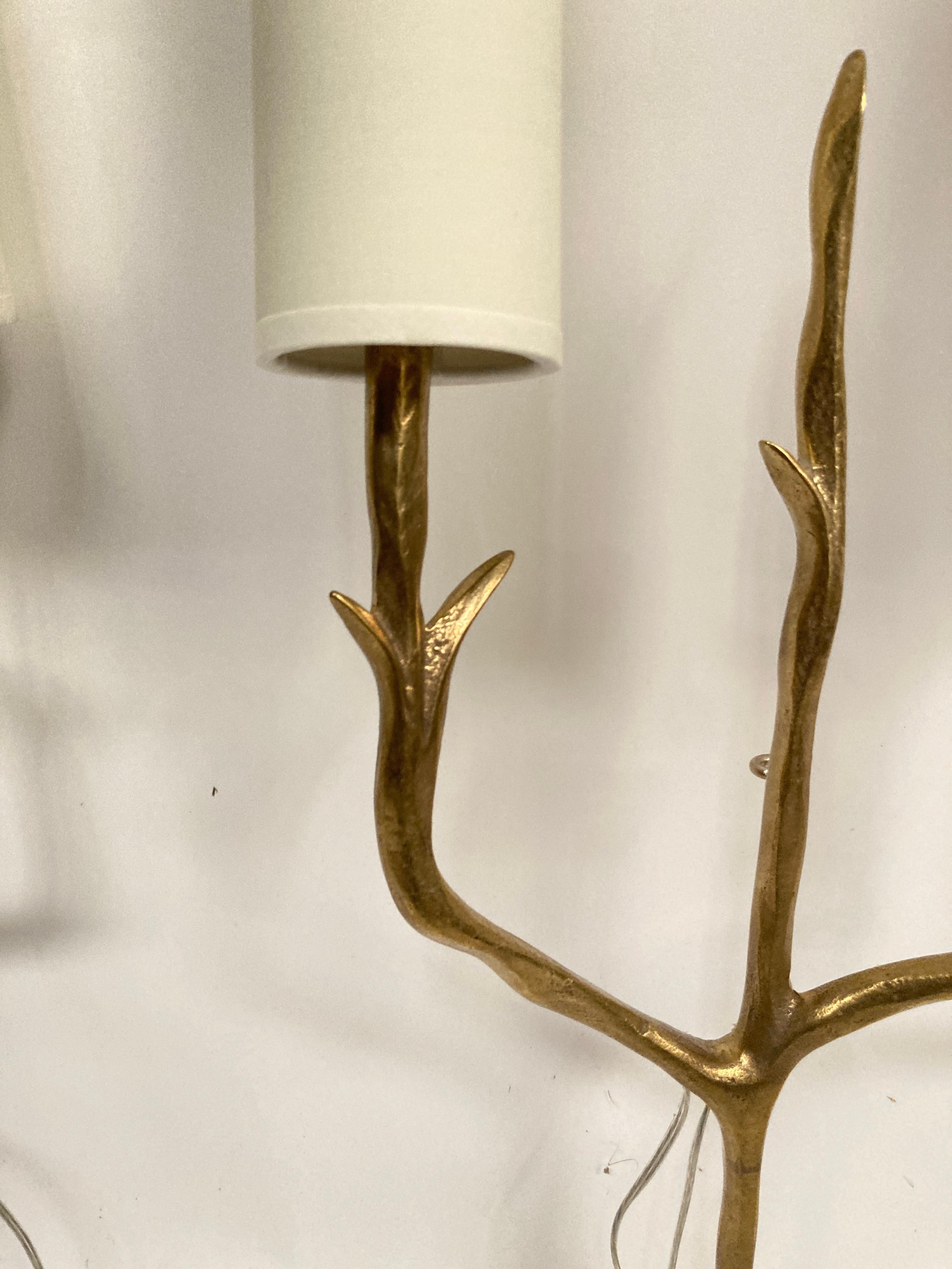 French Pair of bronze sconces in the style of Felix Agostini For Sale