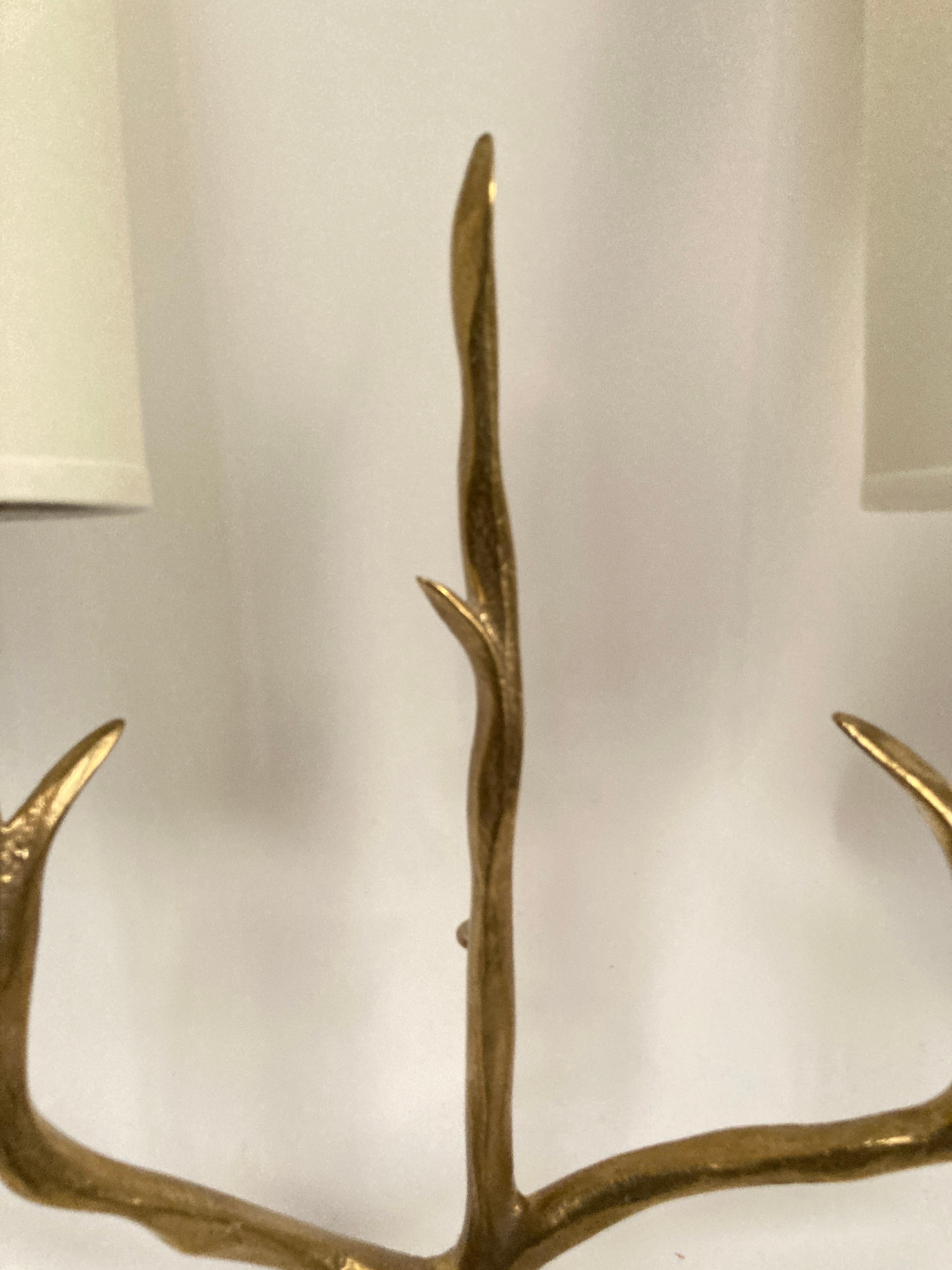 Mid-20th Century Pair of bronze sconces in the style of Felix Agostini For Sale