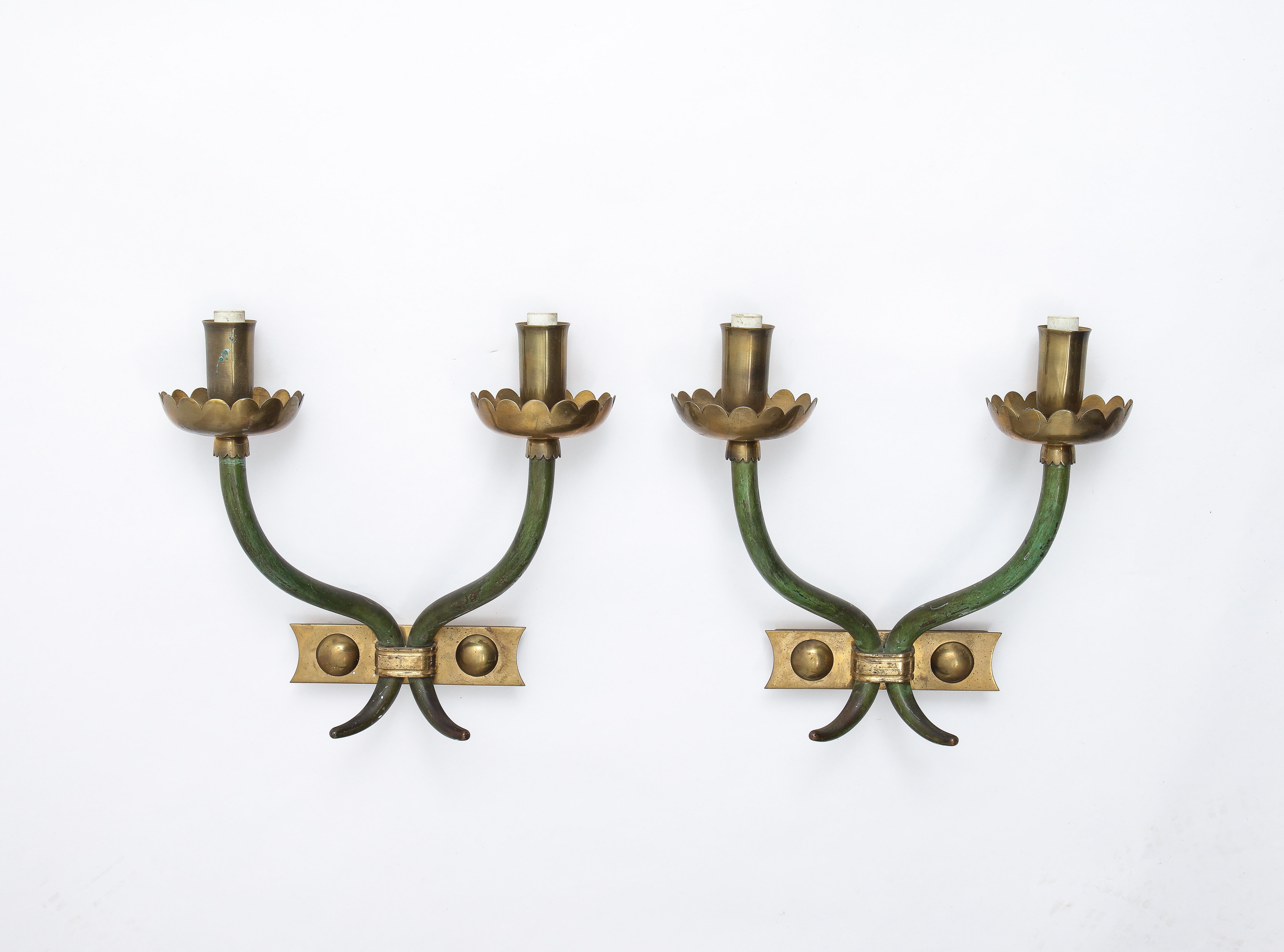Pair of neoclassic sconces with two lights. Bronze swooping arms with verdigris patina and ornate brass details. Rewired.