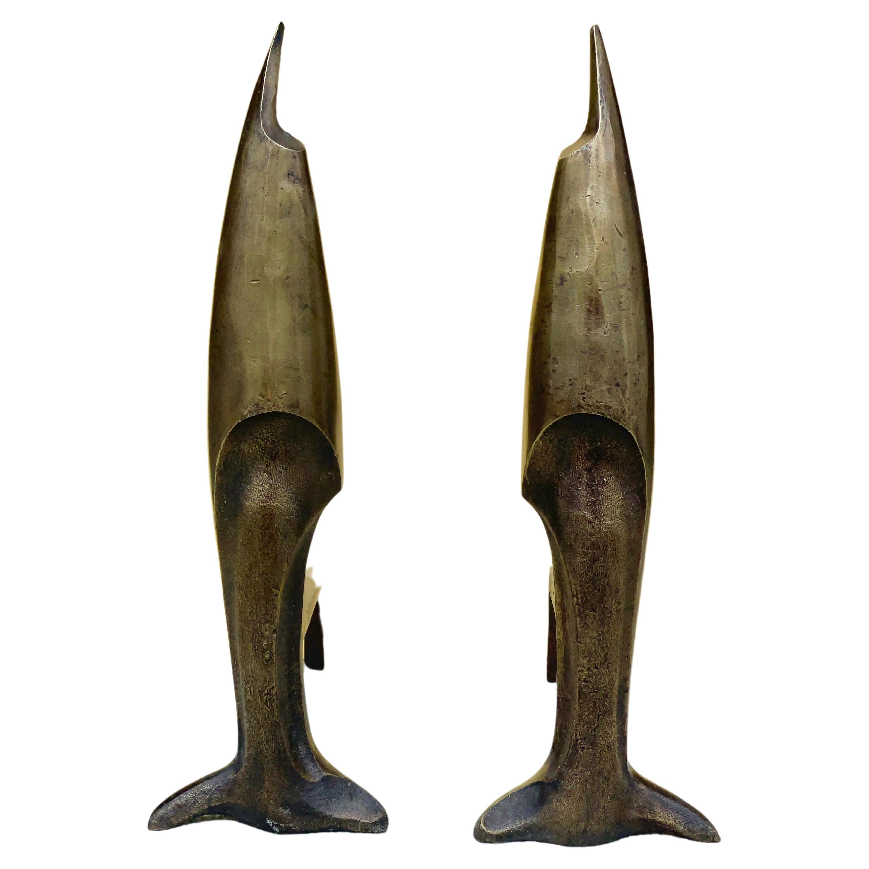 Pair of heavy cast bronze sculptural andirons in the form of a swordfish or dolphin in the manner of a 1926 design by Pierre Emile Legrain.
Apparently unsigned and unmarked.
Original articulating cast iron dogs.
Presented as found with original