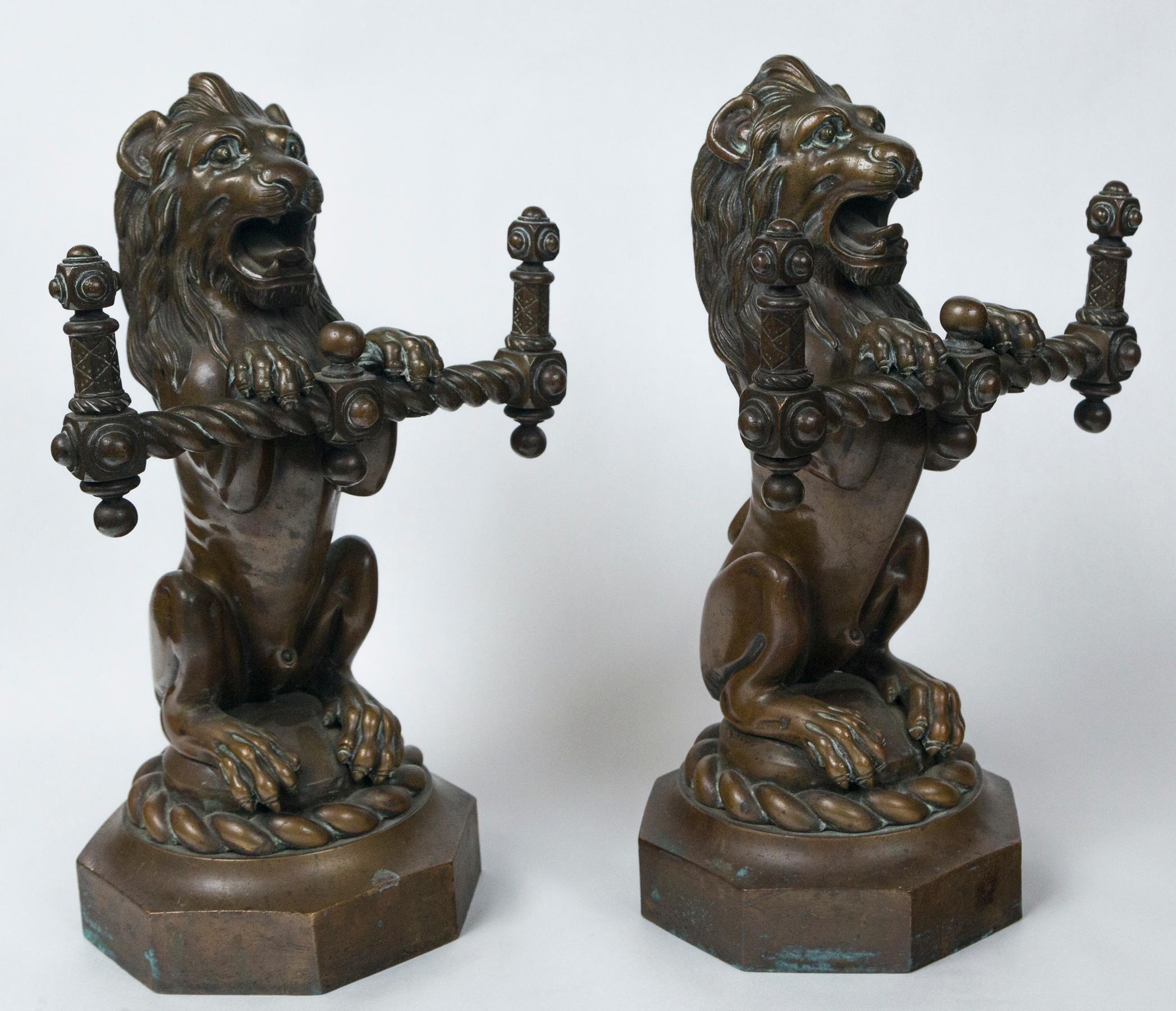 Cast Pair of Bronze Seated Lions For Sale
