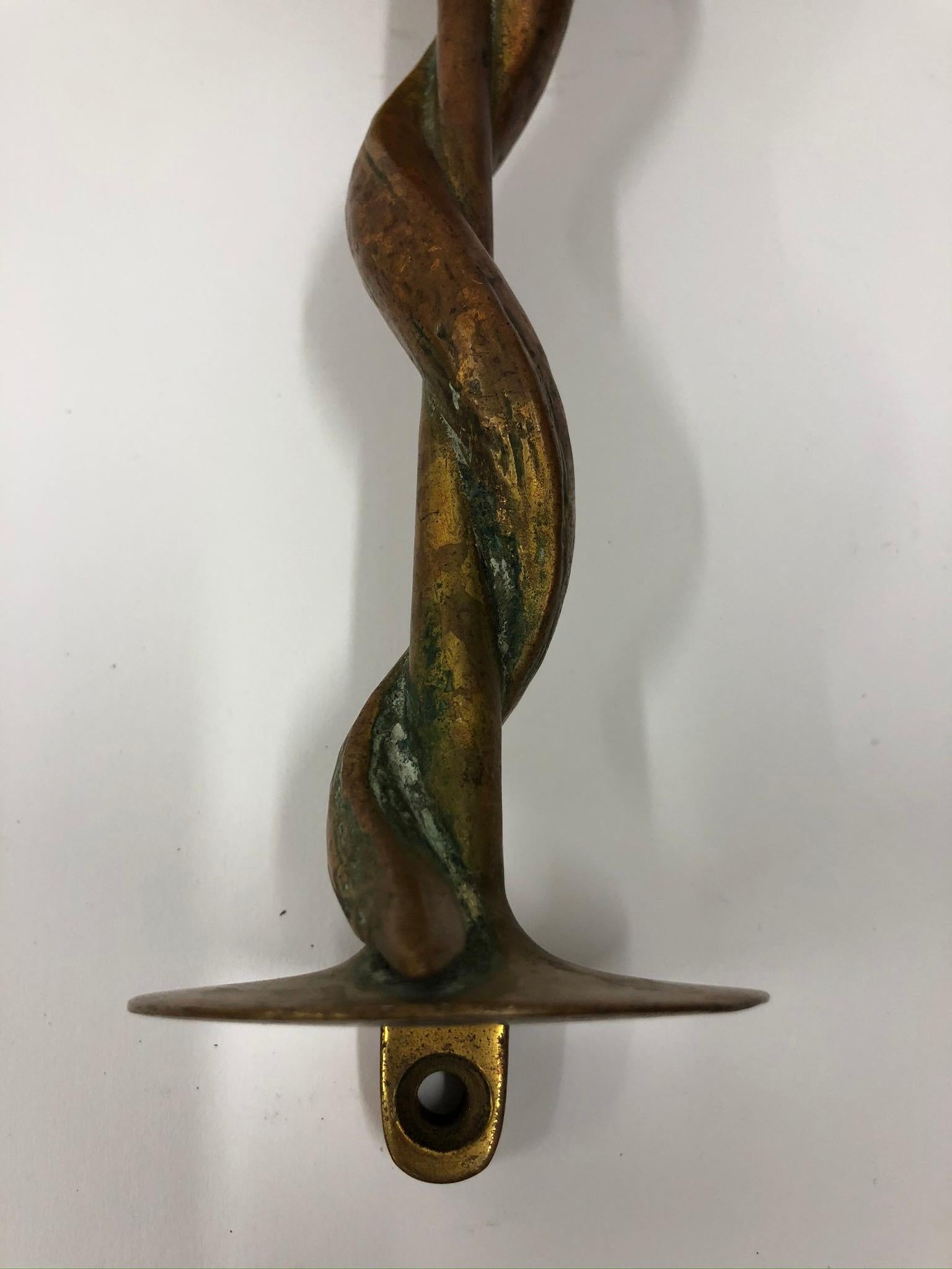 Pair of bronze snake door handles.

Property from esteemed interior designer Juan Montoya. Juan Montoya is one of the most acclaimed and prolific interior designers in the world today. Juan Montoya was born and spent his early years in Colombia.