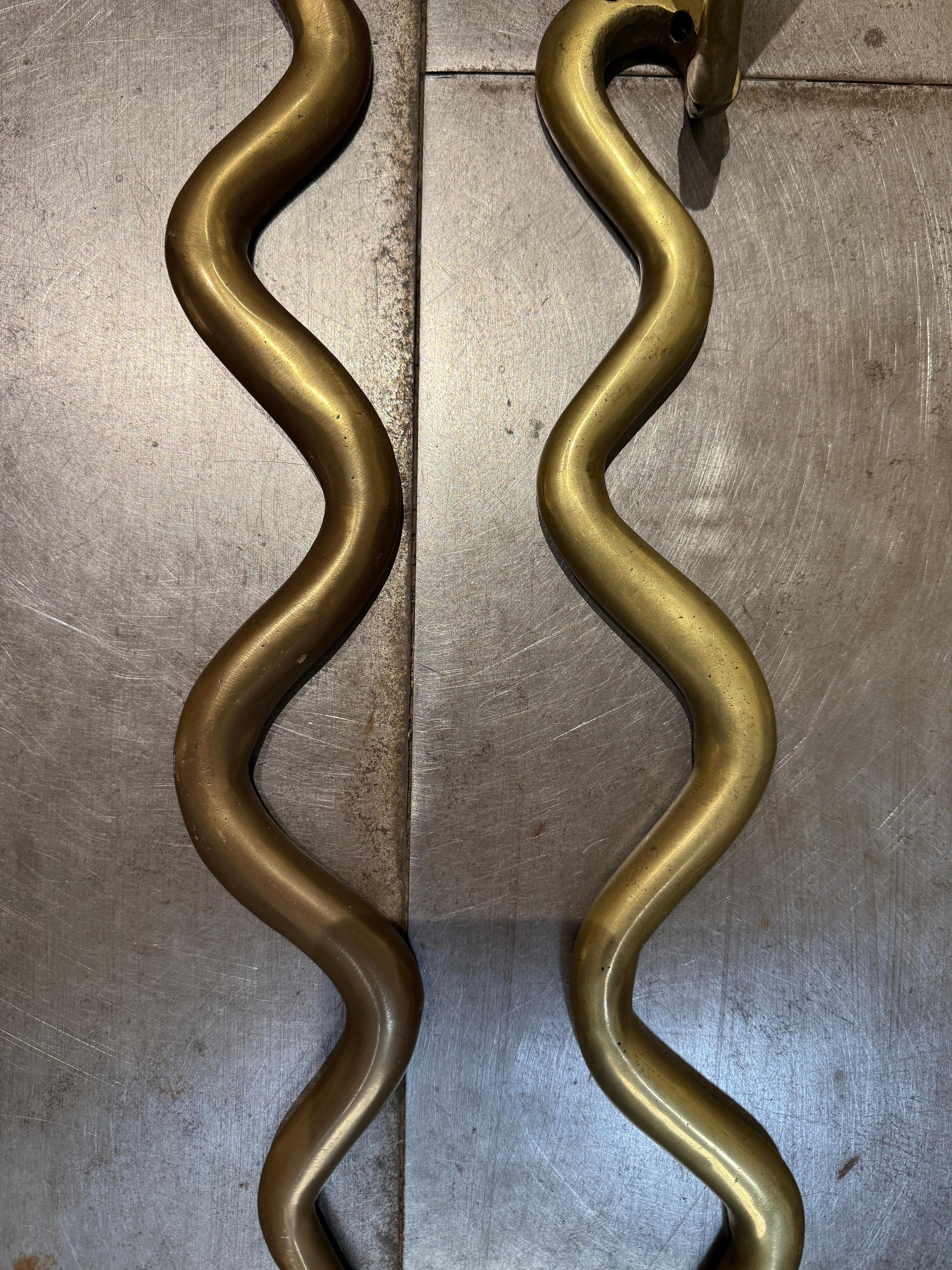Bronze Pair of bronze snakes wall sconces circa 1960 italy