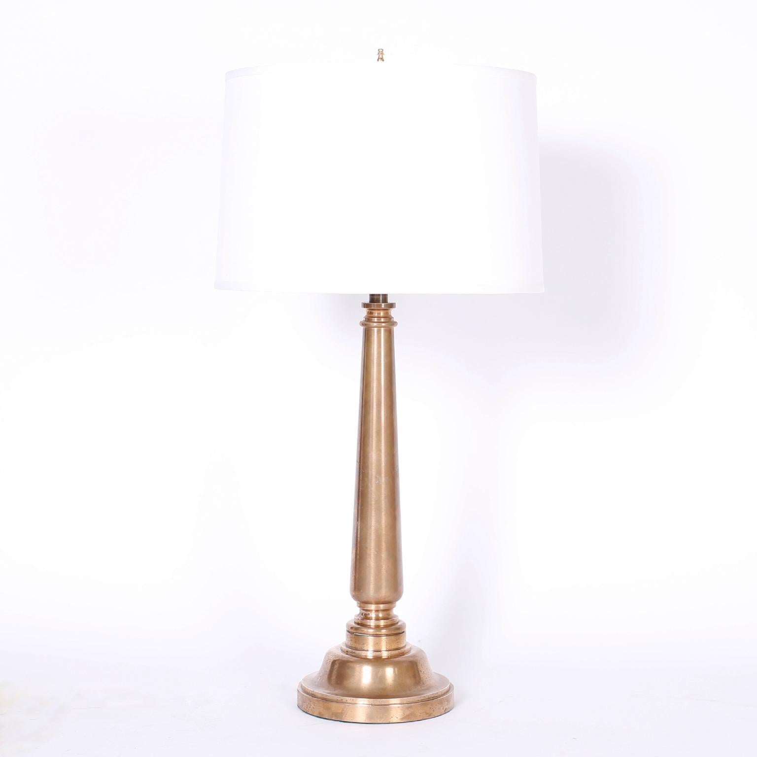 Pair of midcentury table lamps crafted in bronze with a modern, yet classical form and a lush polished patina.