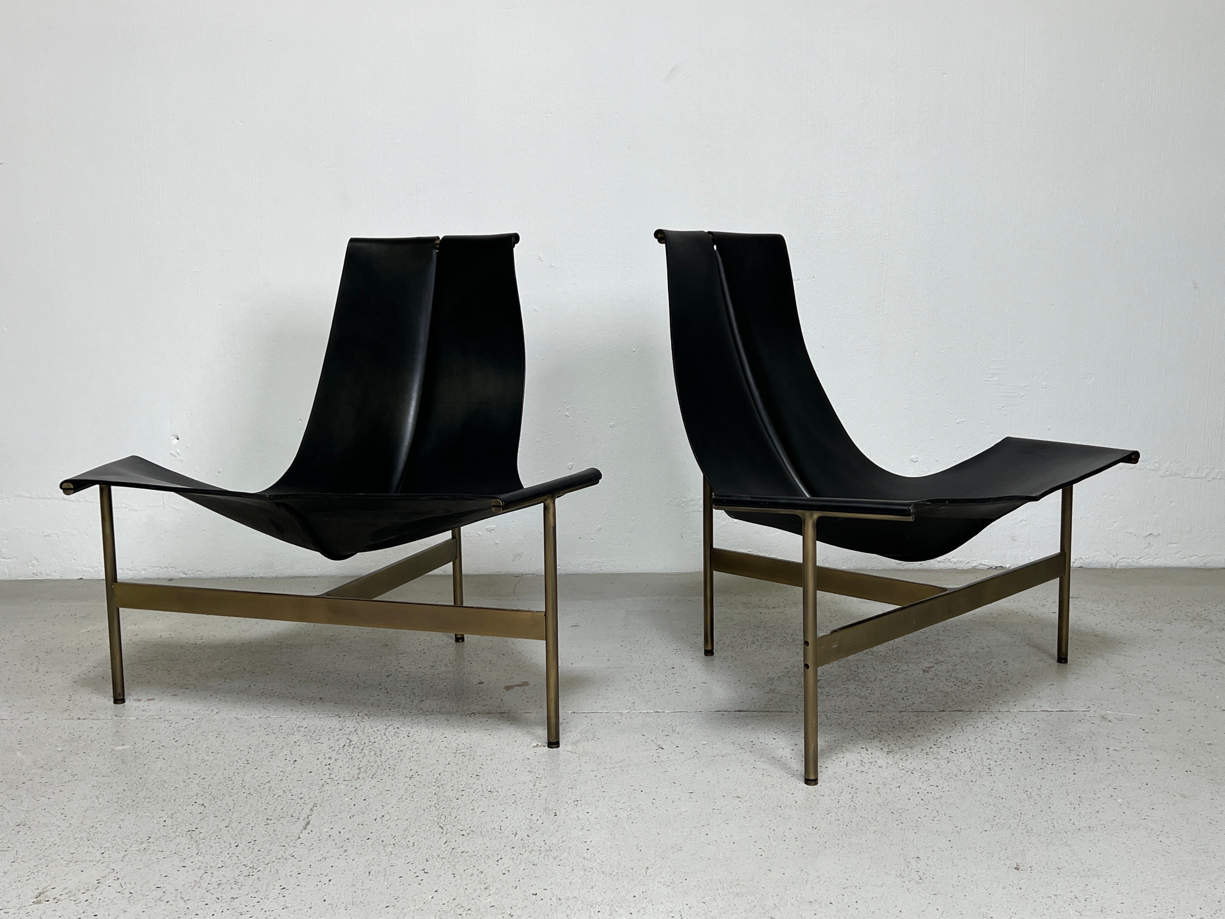 A pair of TG-15 lounge chairs with Bridle saddle leather slings and solid bronze frames. Designed by William Katavolos, Ross Littell and Douglas Kelley in 1952 as part of the original Laverne Collection produced by Gratz Industries.