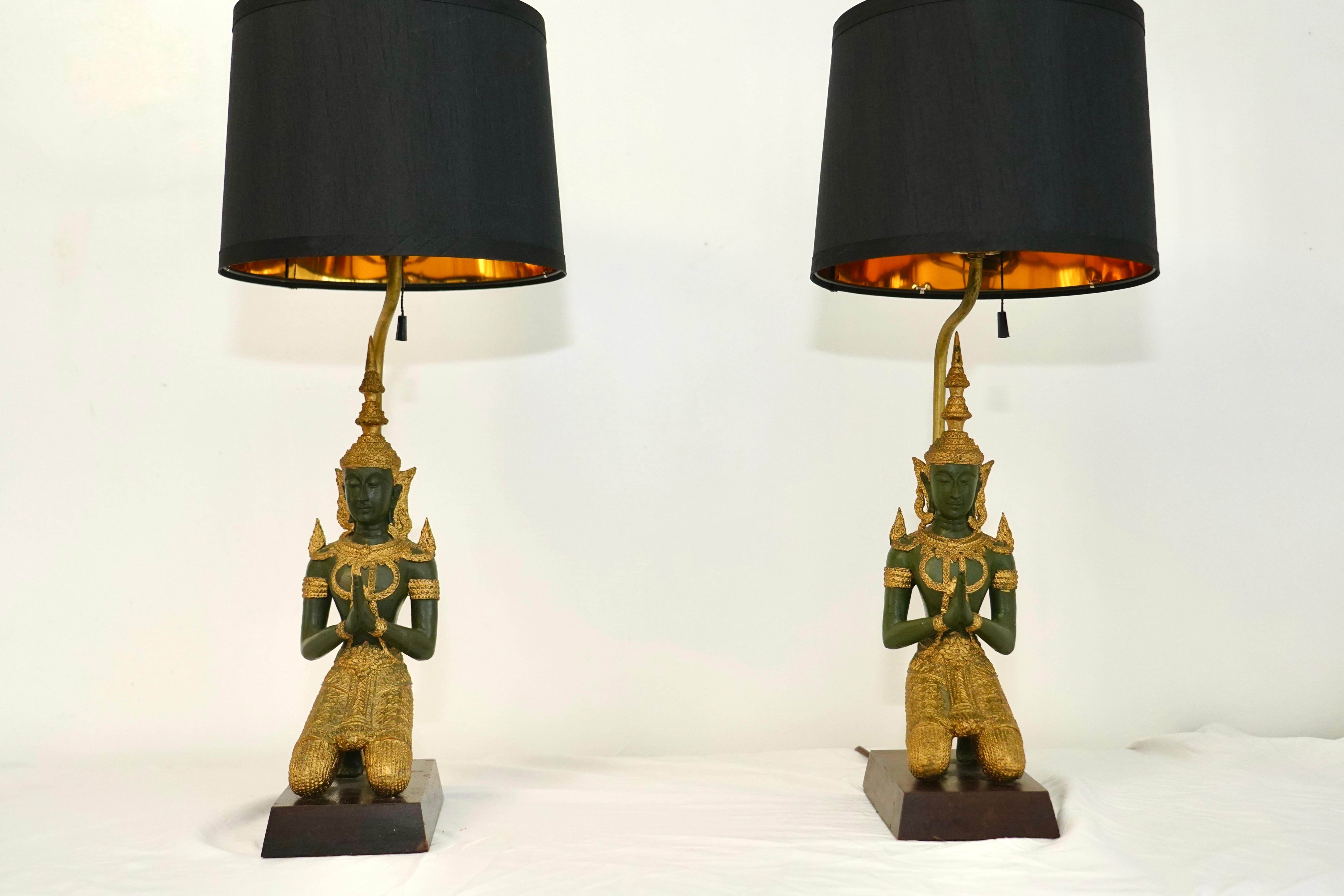 Tibetan Pair of bronze Thai Teppanom kneeling Buddha table lamps. Hollywood Regency For Sale