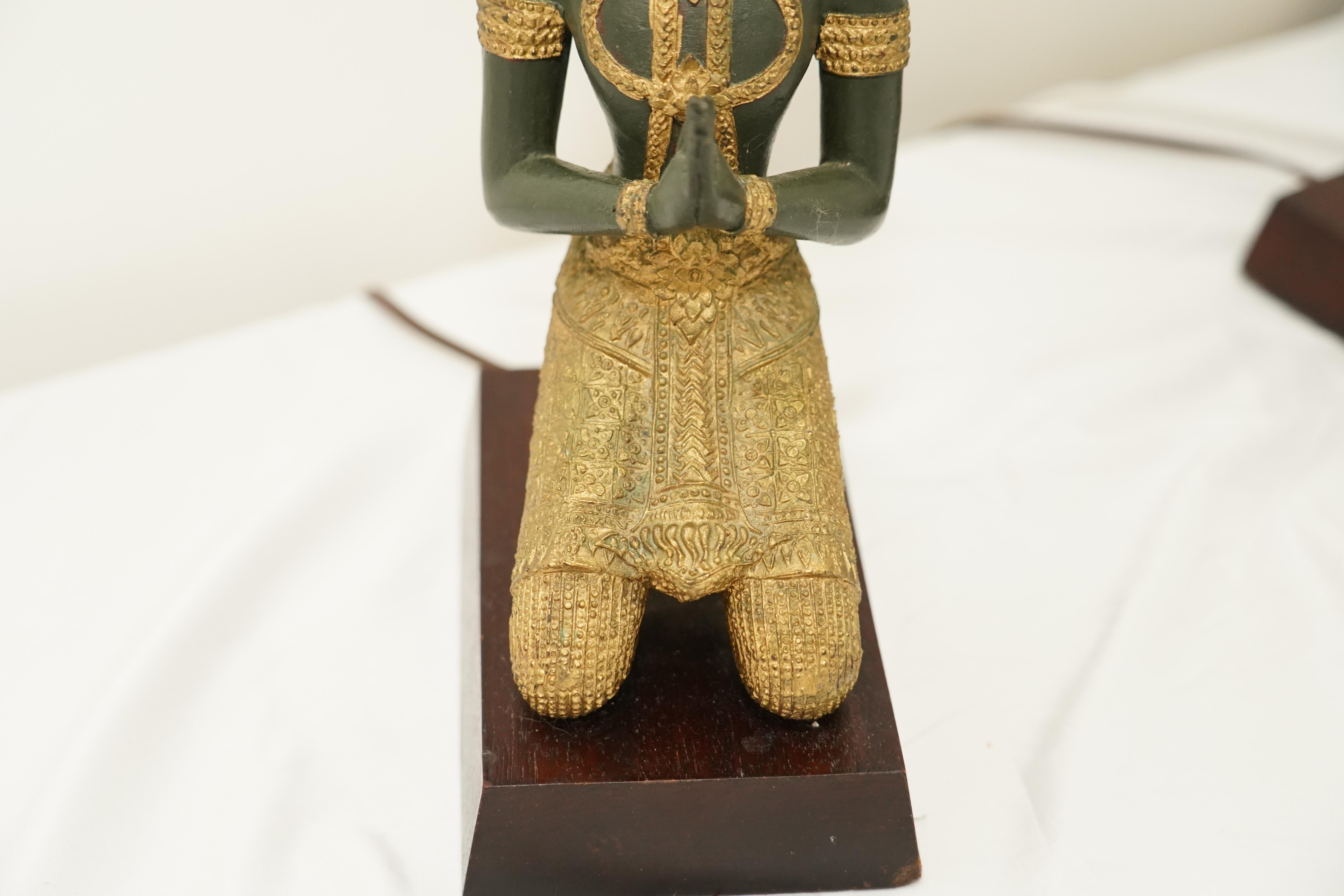 Pair of bronze Thai Teppanom kneeling Buddha table lamps. Hollywood Regency For Sale 1