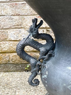 Pair of Bronze Urns with Dragon Handles