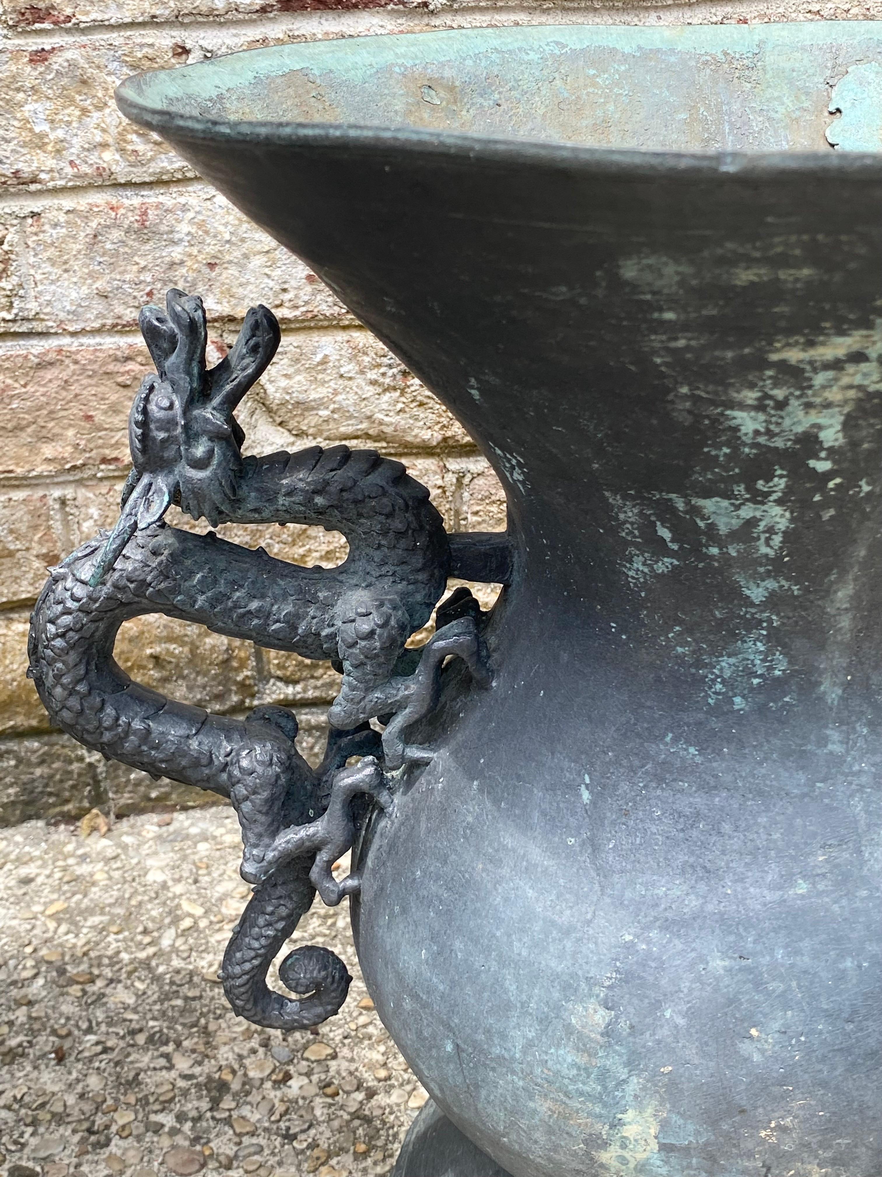 Pair of Bronze Urns with Dragon Handles In Fair Condition For Sale In East Hampton, NY