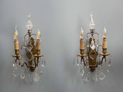 Pair of bronze wall lamps with crystal hangings