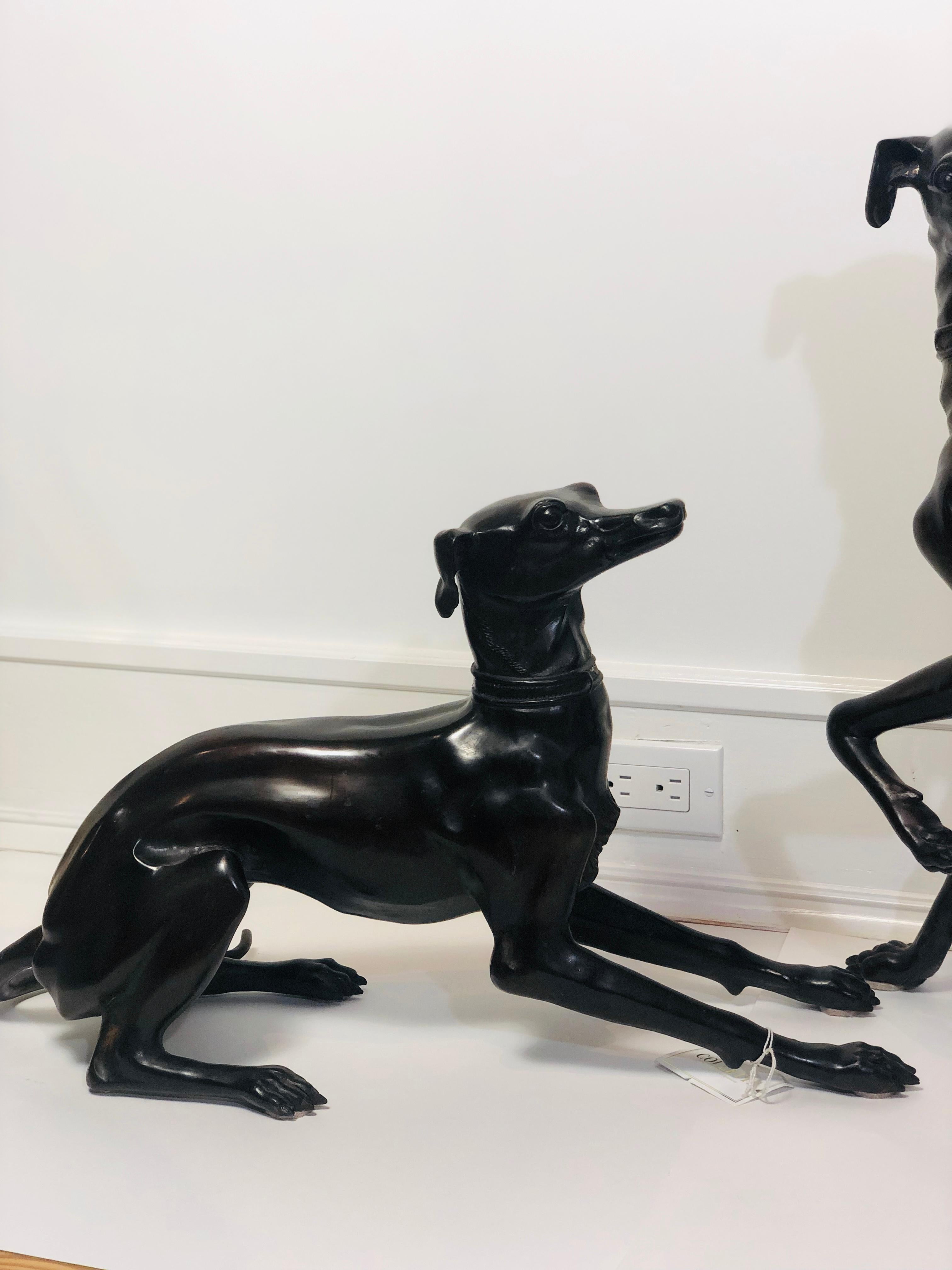 Pair of small bronze Whippet Statues measuring approximately 22