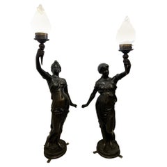 Pair of Bronze Woman Torcheres