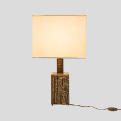 Pair of sculptural bronzed brass table lamps designed by Luciano Frigerio