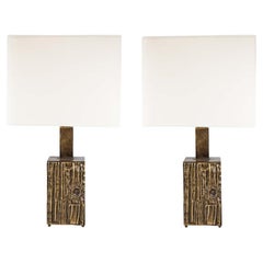 Pair of sculptural bronzed brass table lamps designed by Luciano Frigerio