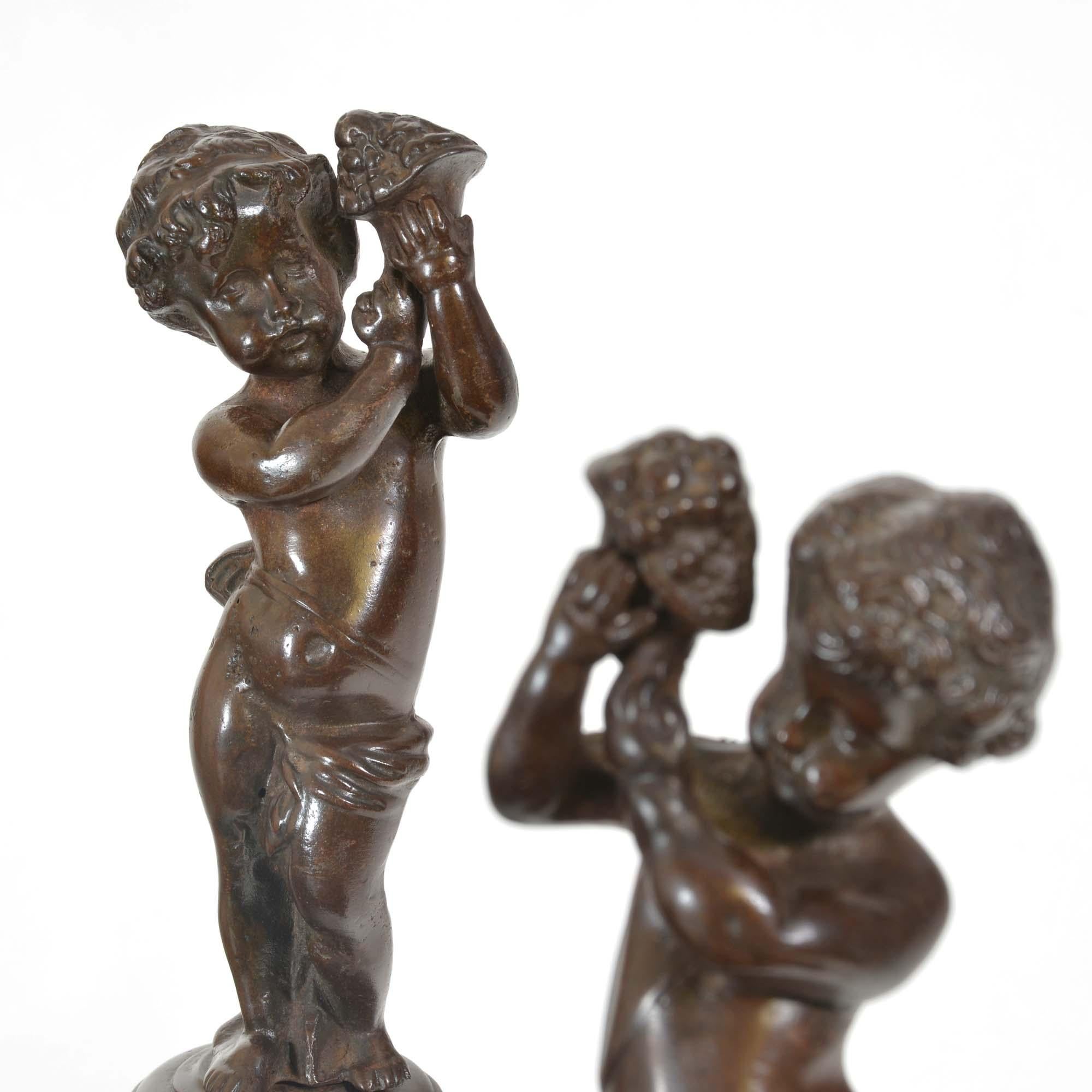 Bronze Pair of bronzed cast iron Italian Renaissance style fire andirons For Sale