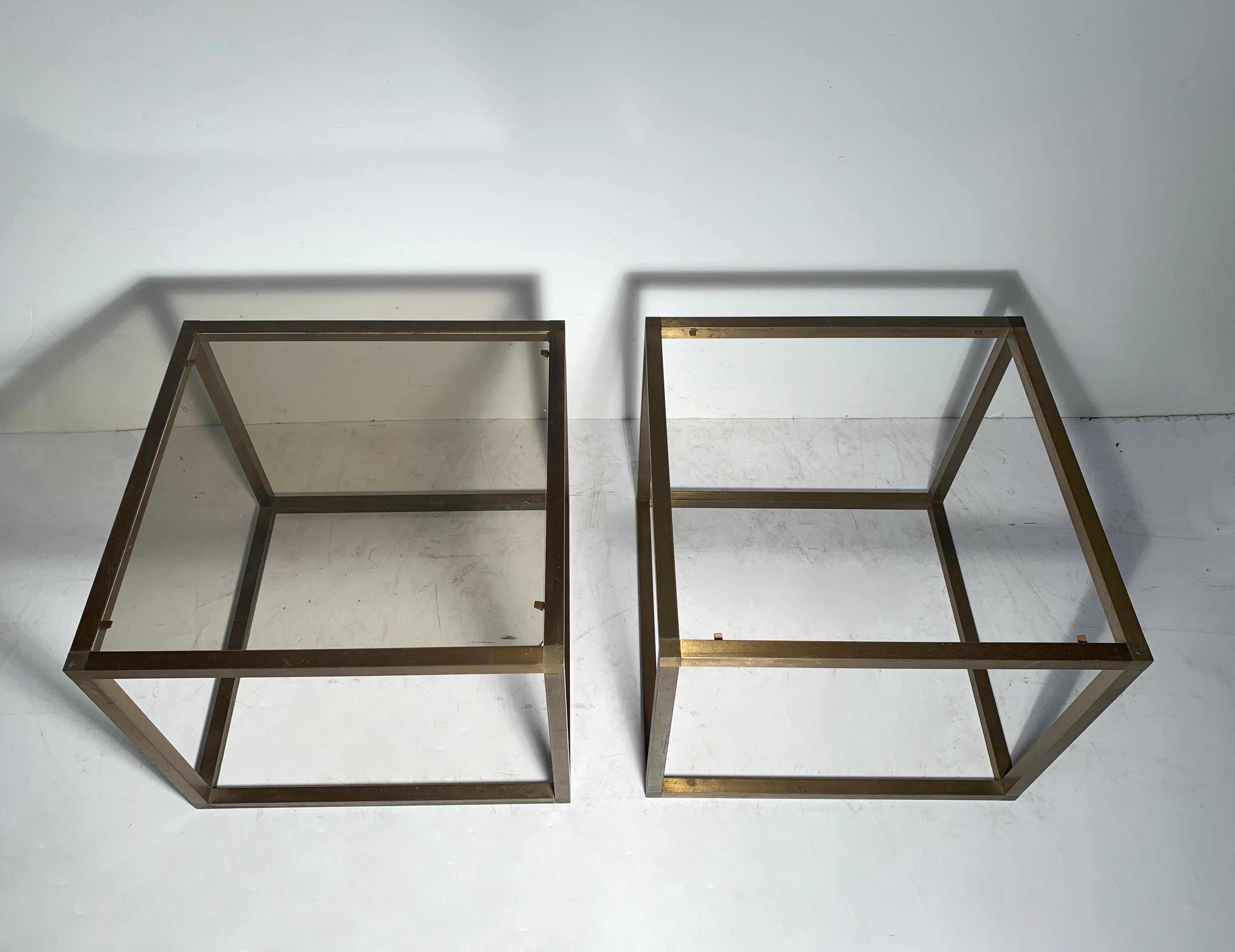 1960s-1970s bronzed extrusion tables with tinted glass. In the manner of Milo Baughman. Possibly Italian.


1 piece of glass has some damage by one corner and some scratches. may want to replace. 
Wear/patina to the finish on the metal with some