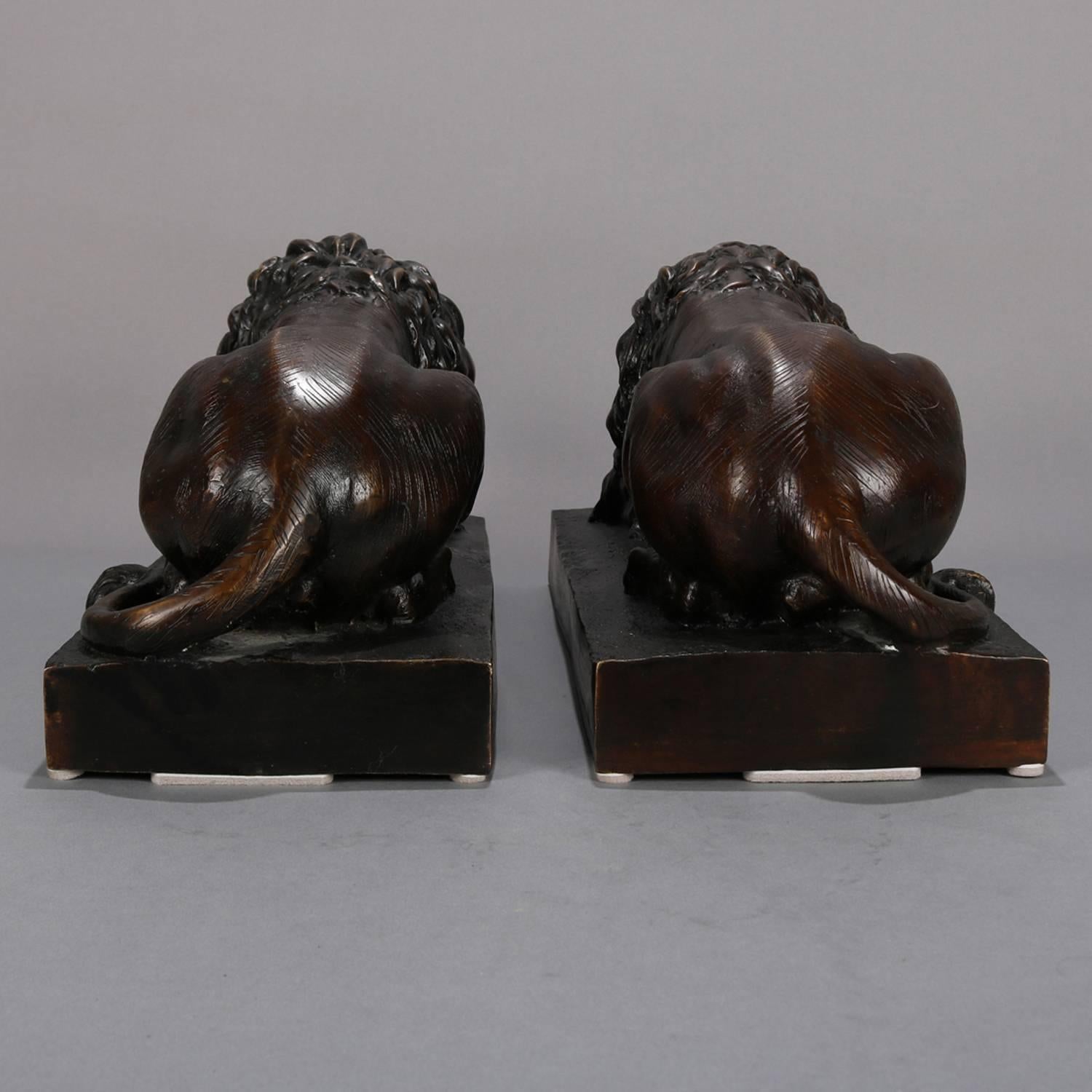 Pair of Bronzed Metal Sculptures of Recumbent African Lions, 20th Century 1