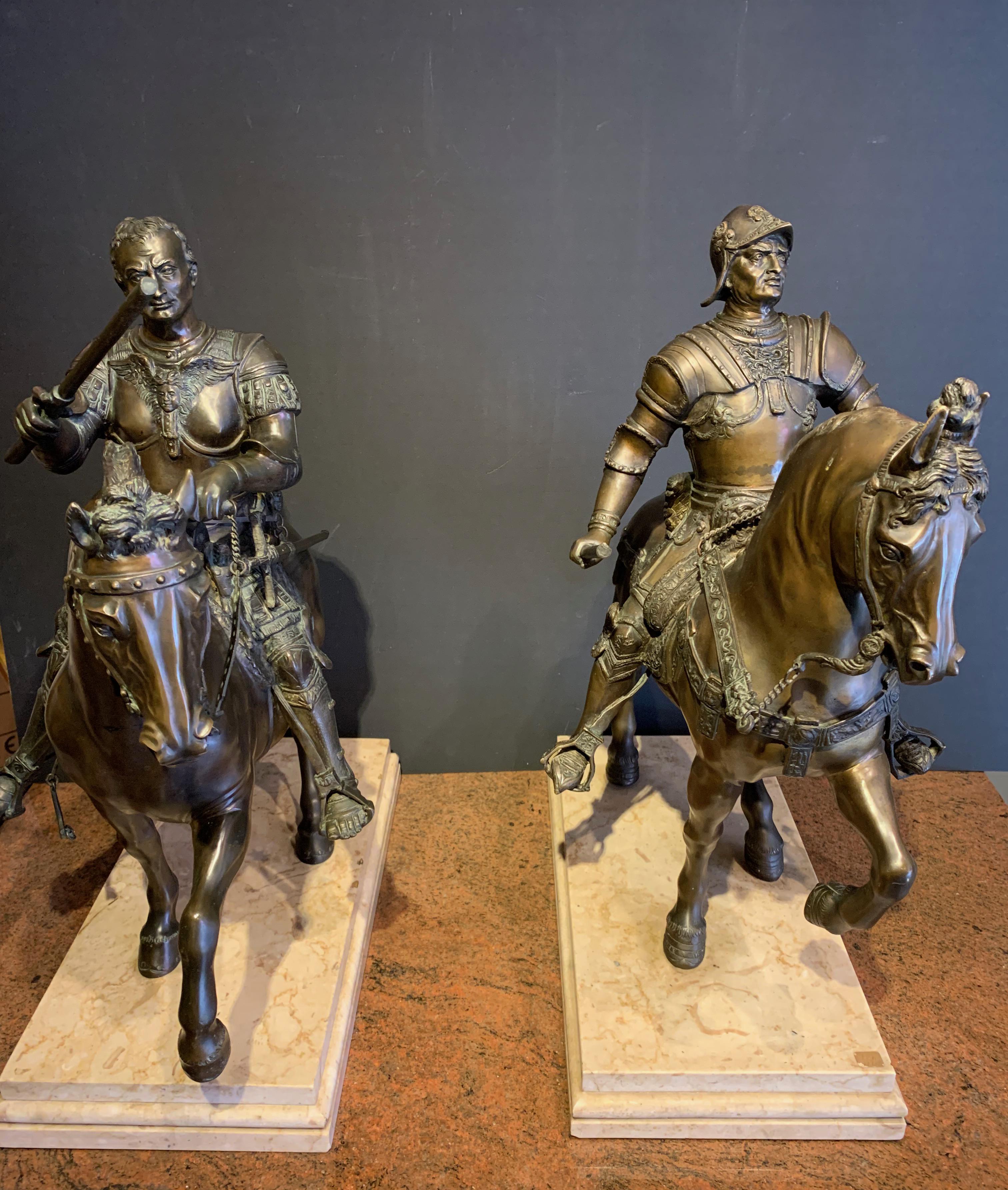 Pair of large brown patina bronzes featuring Condottiere straddling a horse.
One is that of Bartolomeo Colleoni, Lieutenant General of the Serenissima, based on a bronze by Andrea del Verrochio, who worked on it from 1483 to 1488.
Cast by Alessandro