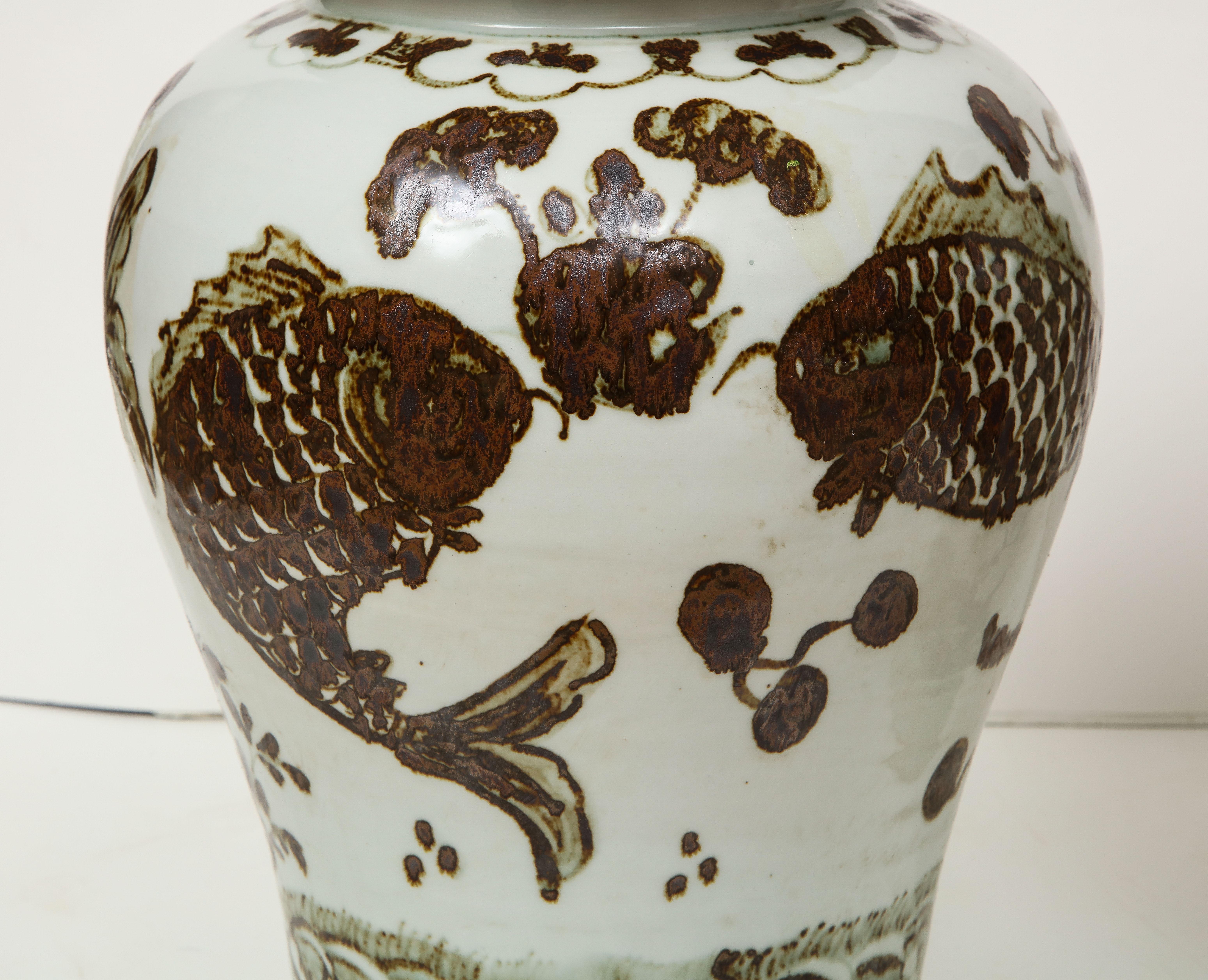 This pair of Chinese vases with lids can add the perfect finishing touch to a room, as the rich chocolate brown looks great with blues, greens, reds....everything. These vases would looks beautiful on a mantelpiece and they are sure to add that