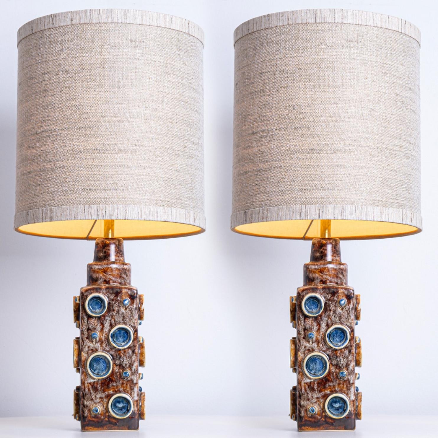 Ceramic table lamps by Soholm, Denmark, 1960s. This high-end sculptural piece is handmade ceramic in brown and blue tones. With a new custom made neutral silk lamp shade with beige inner-shade by René Houben.

The pair is in perfect vintage