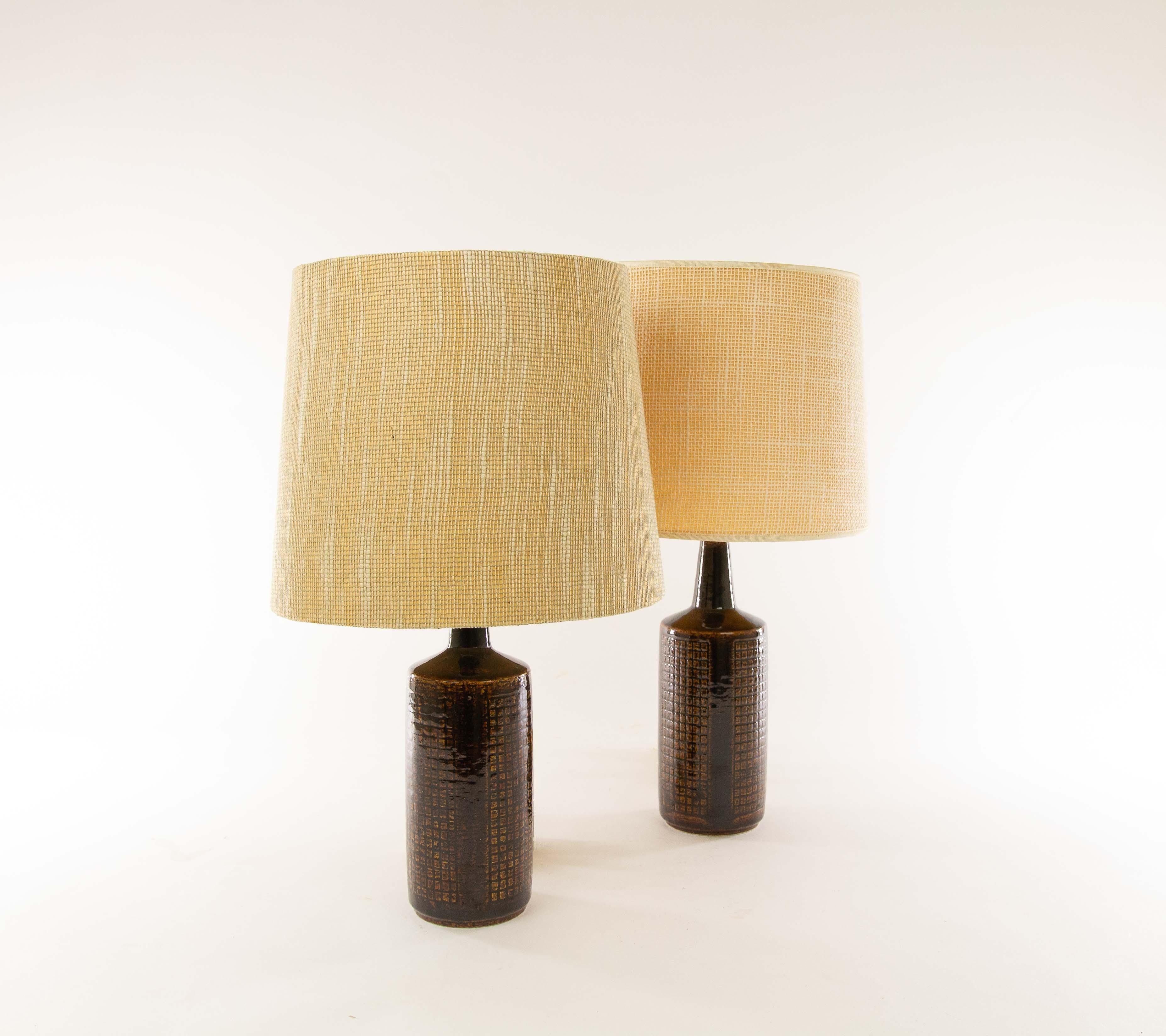 A pair of DL/30 table lamps made by Annelise and Per Linnemann-Schmidt for Palshus in the 1960s. 

The color of both pieces is brown. Although both pieces are very similar, they are not exactly the same. There are small differences in patterns,