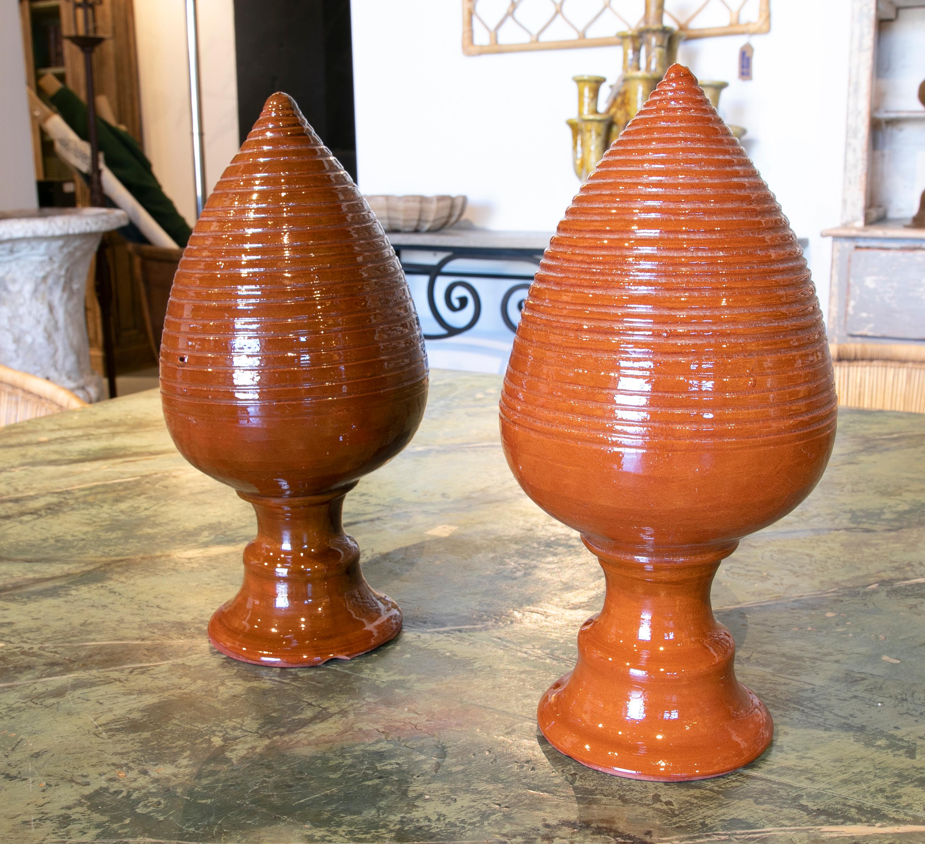 Pair of brown glazed ceramic finials with pineapple shape.