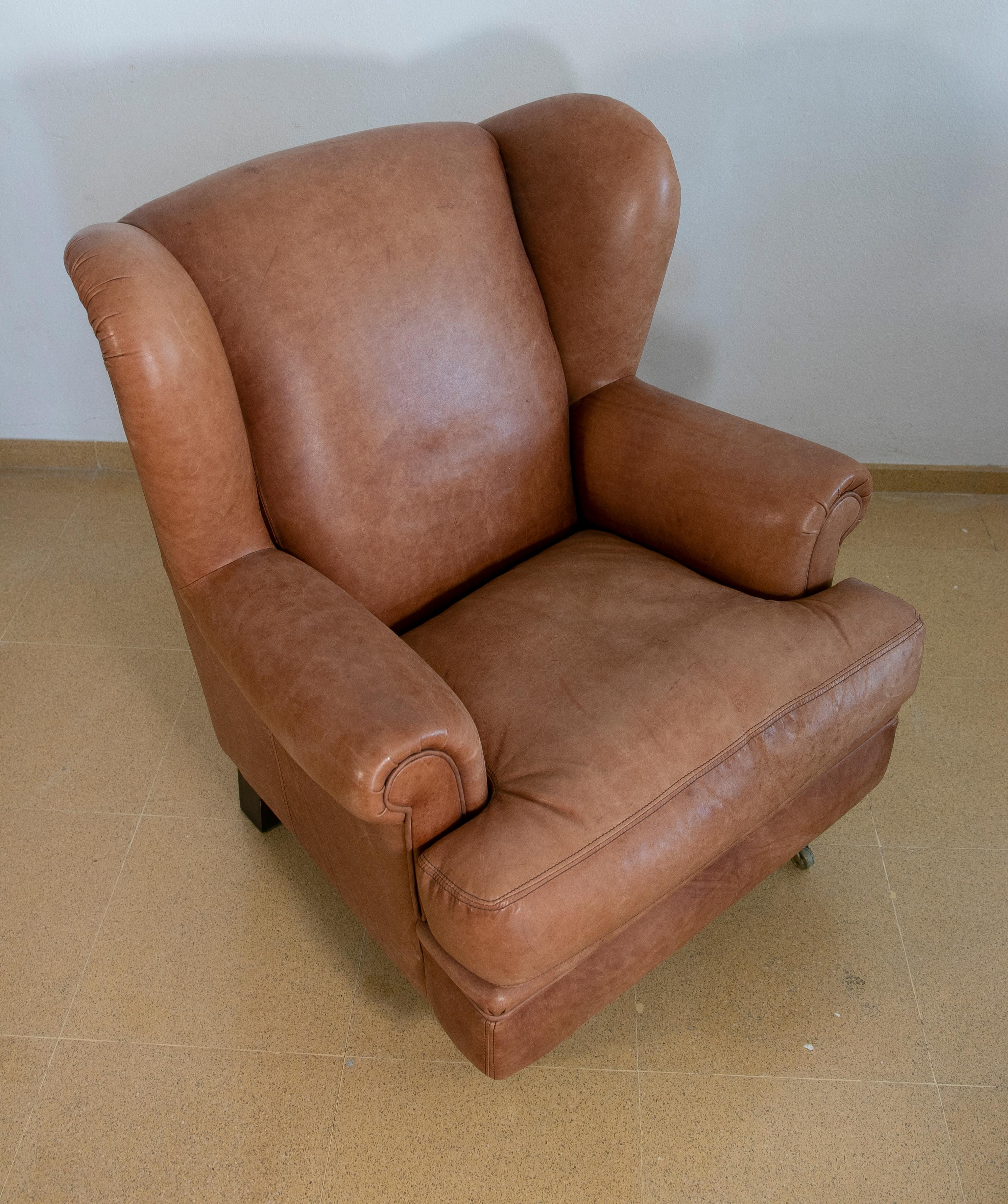 Pair of Brown Leather Armchairs with Wooden Legs and Brass Wheels For Sale 3