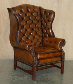PAIR OF BROWN LEATHER THOMAS CHiPPENDALE CHESTERFIELD TUFTED WINGBACK ARMCHAIRS