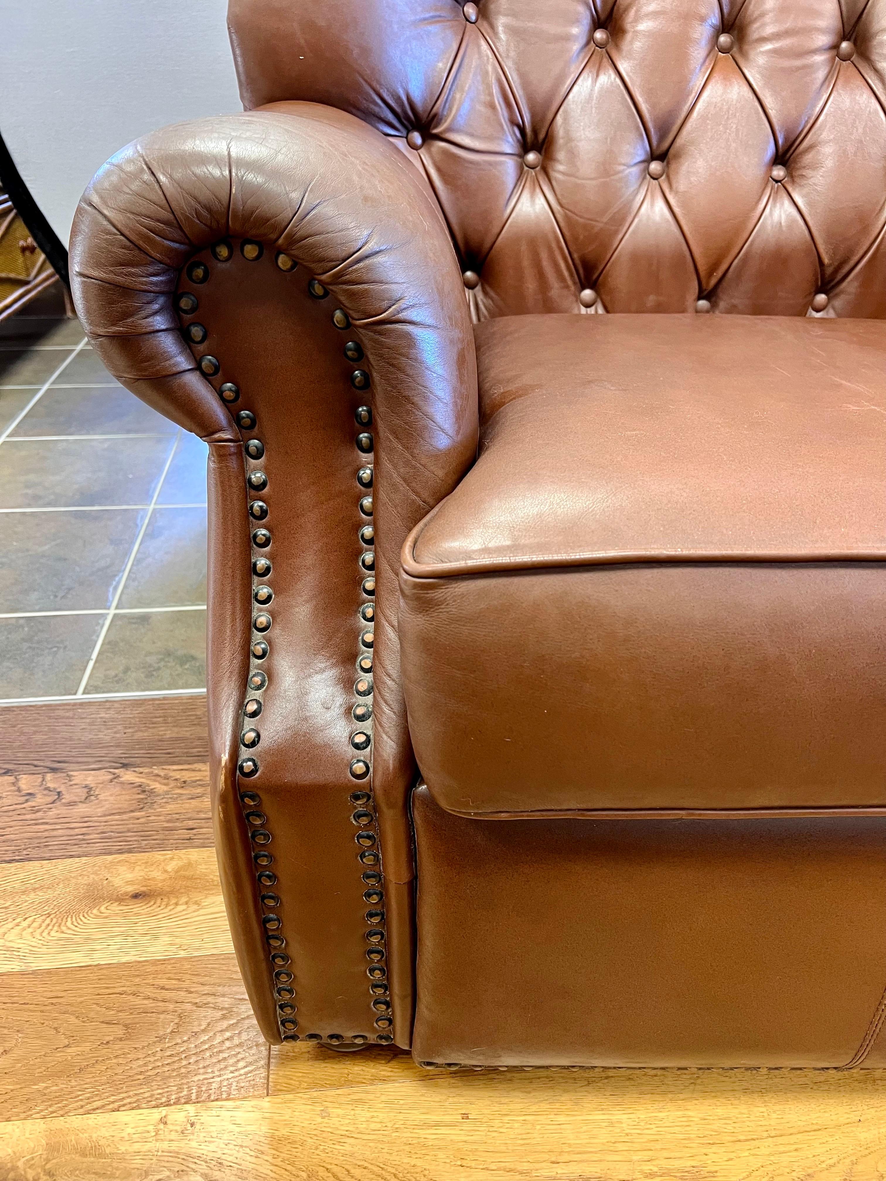 brown leather tufted chair