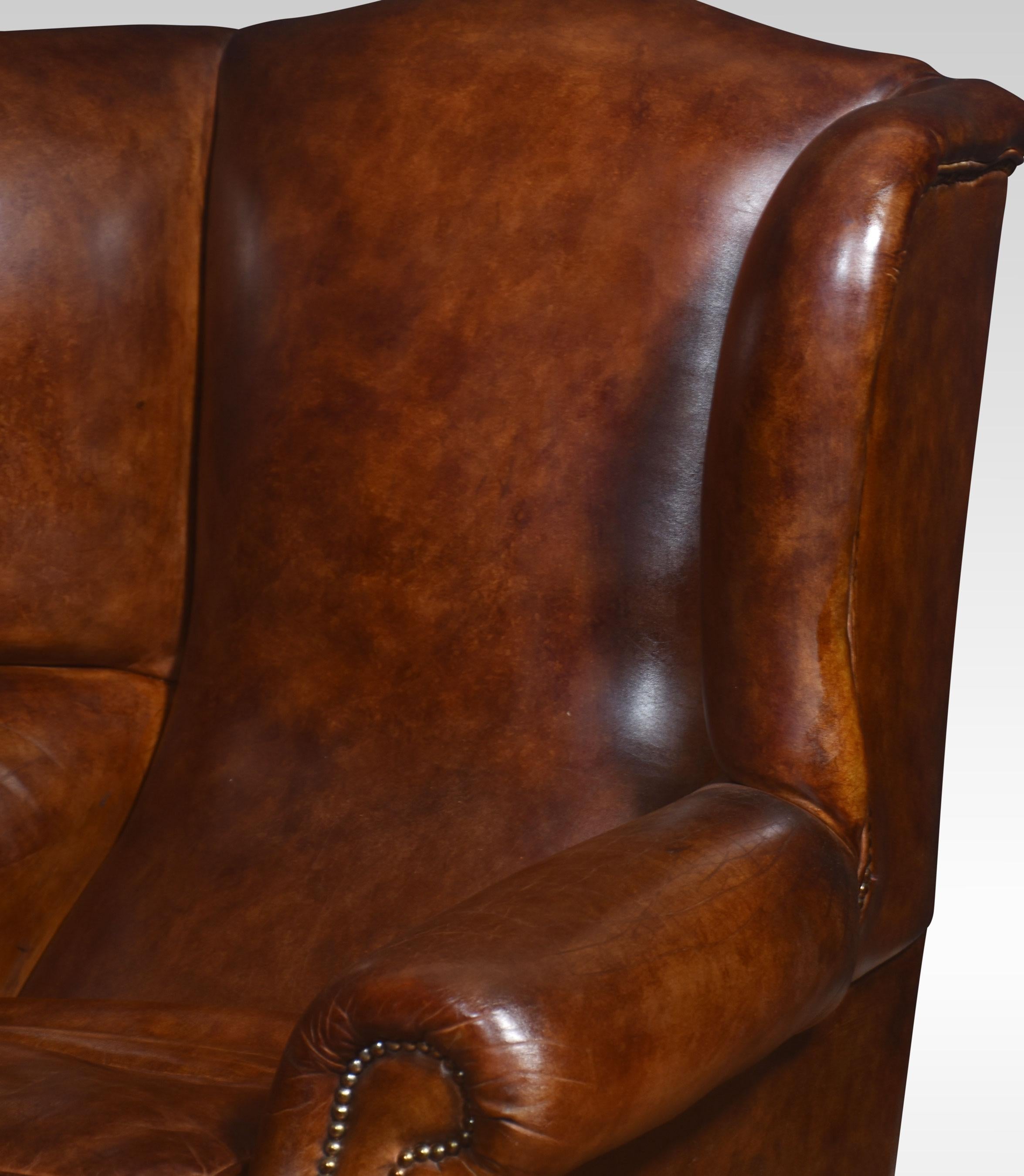 20th Century Pair of brown leather upholstered wingback armchairs For Sale