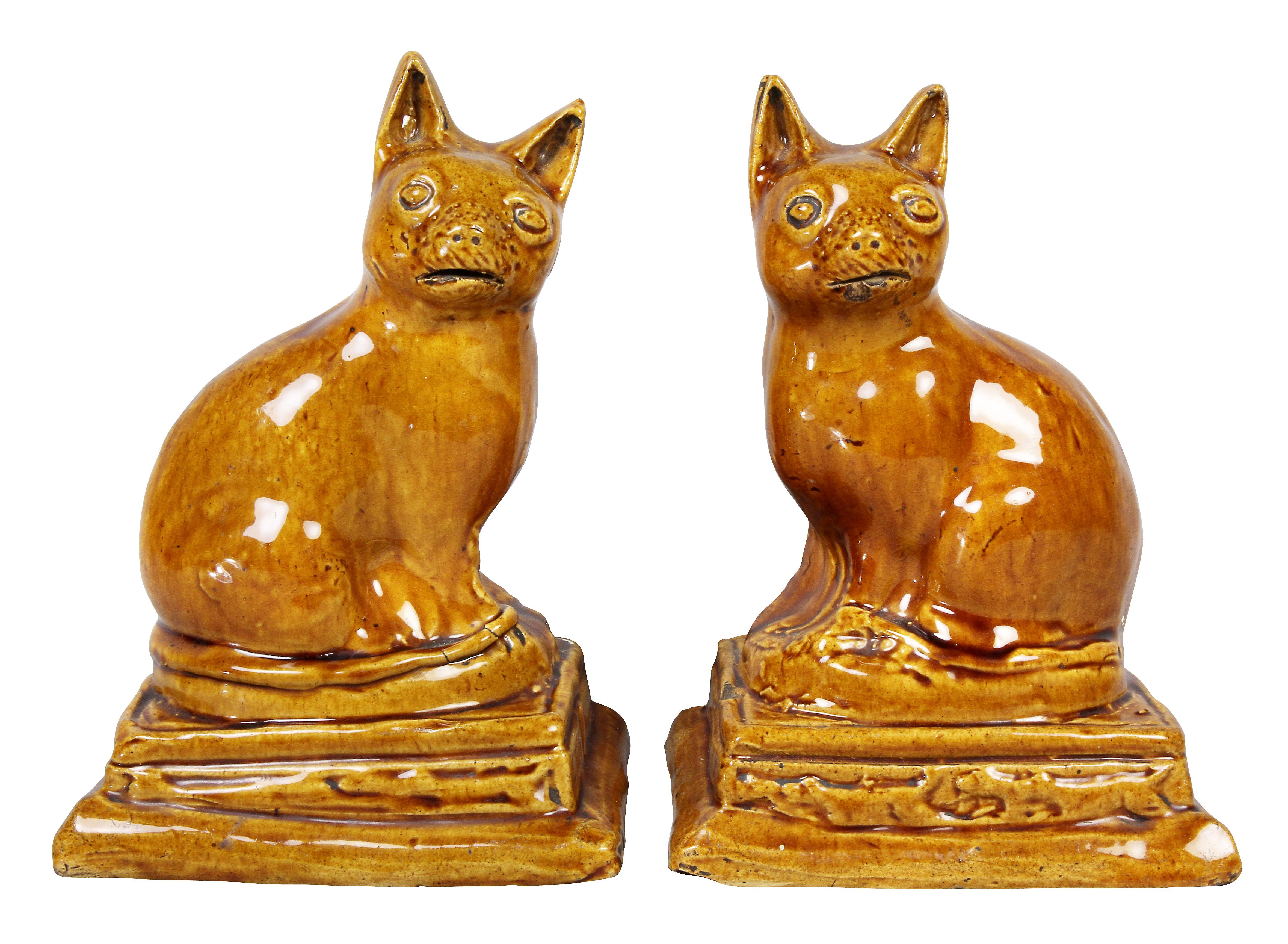 Each with cute expressions seated on a plinth base. Provenance, Manheim Antiques. Drue Heinz.