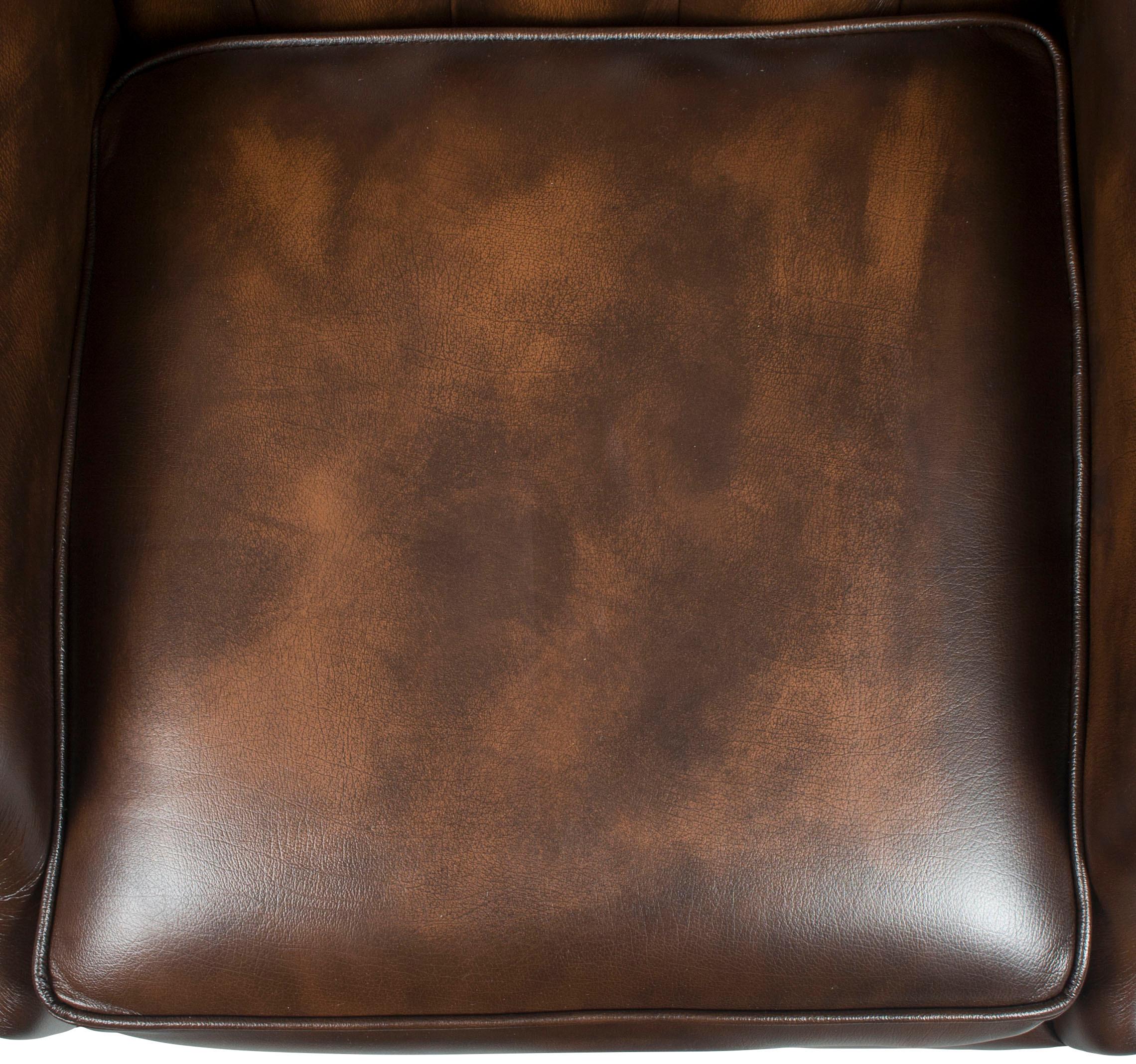 Contemporary Pair of Brown Tufted Leather Wing Back Armchairs