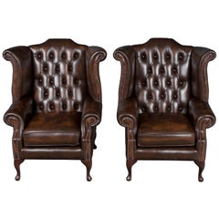 Pair of Brown Tufted Leather Wing Back Armchairs