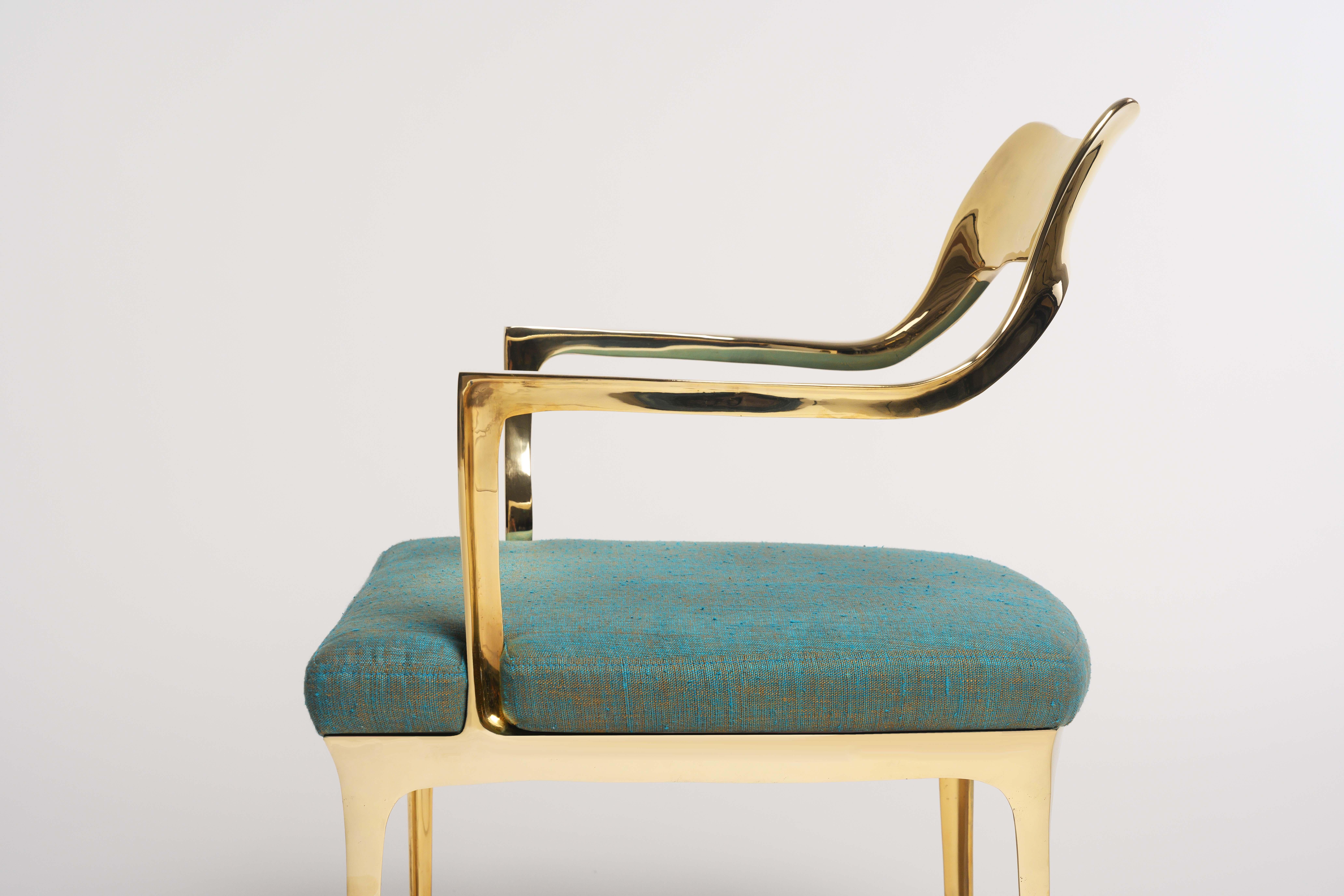 Available for pick up at the NY showroom of Elan Atelier.

Armchair and bench with polished gold bronze frame and marine silk linen upholstery. The frames are cast in bronze using the lost wax cast method.

Armchair dimensions:
W 23 x D 22.4 x H