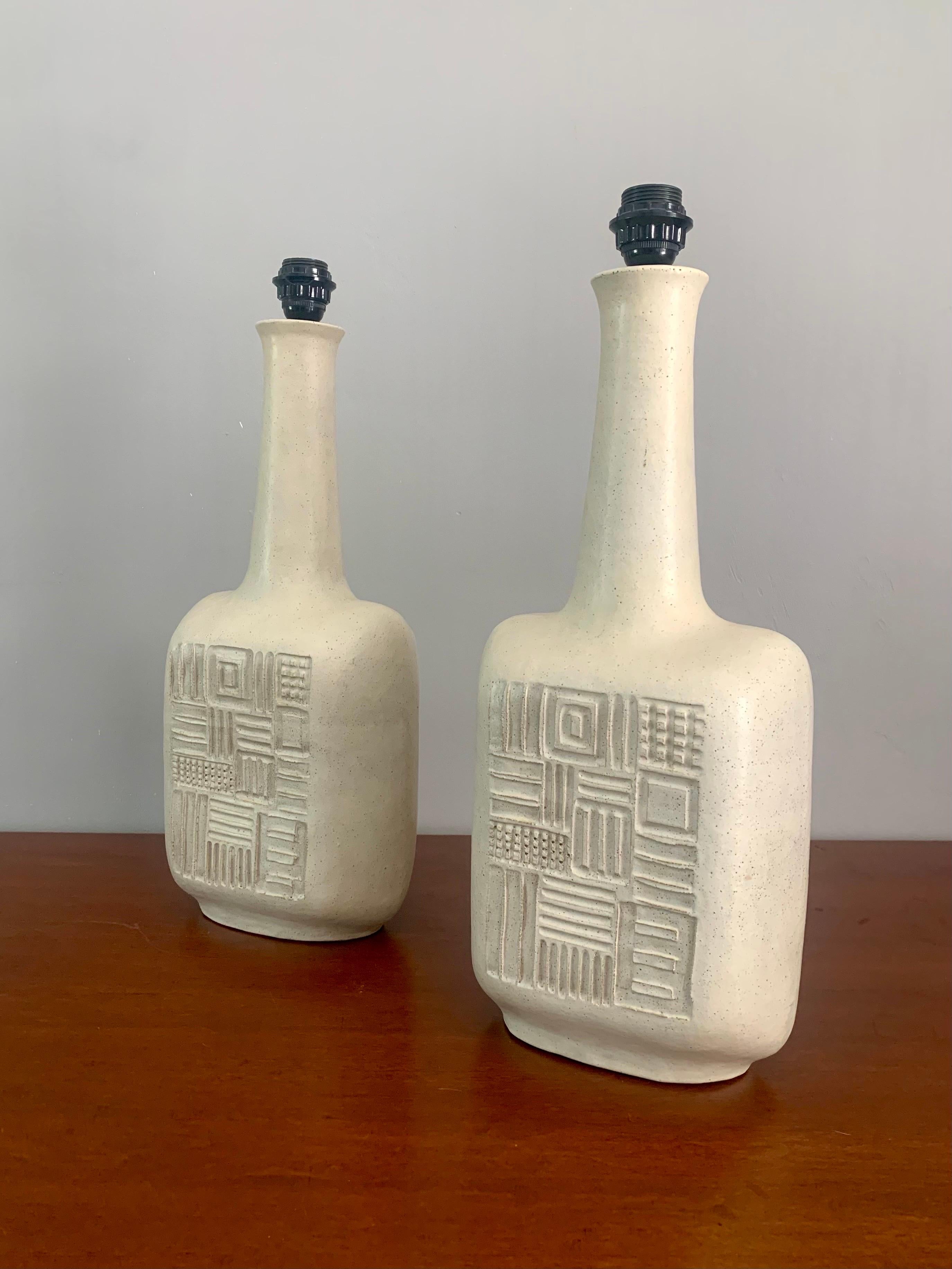 Rare pair of hand thrown ceramic Gambone lamps. I believe their made by Bruno but potentially Guido instead. Each lamp is signed on the bottom “Gambone / Italy”. 

Sculptural lamps are in the form of classic mid century modern vases with a